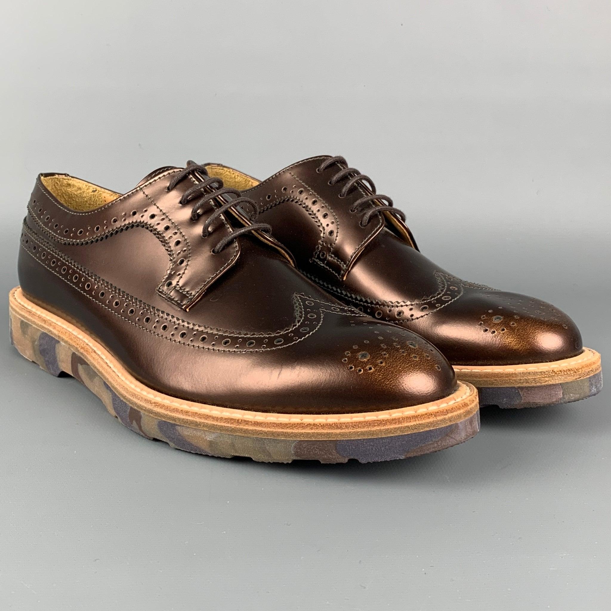 PAUL SMITH 'Men Only' shoes comes in a copper leather featuring a wingtip style, rubber sole, and a lace up closure. Made in Italy.
Excellent
Pre-Owned Condition. 

Marked:   L050 37.5Outsole: 10.5 inches  x 4 inches 
  
  
 
Reference: