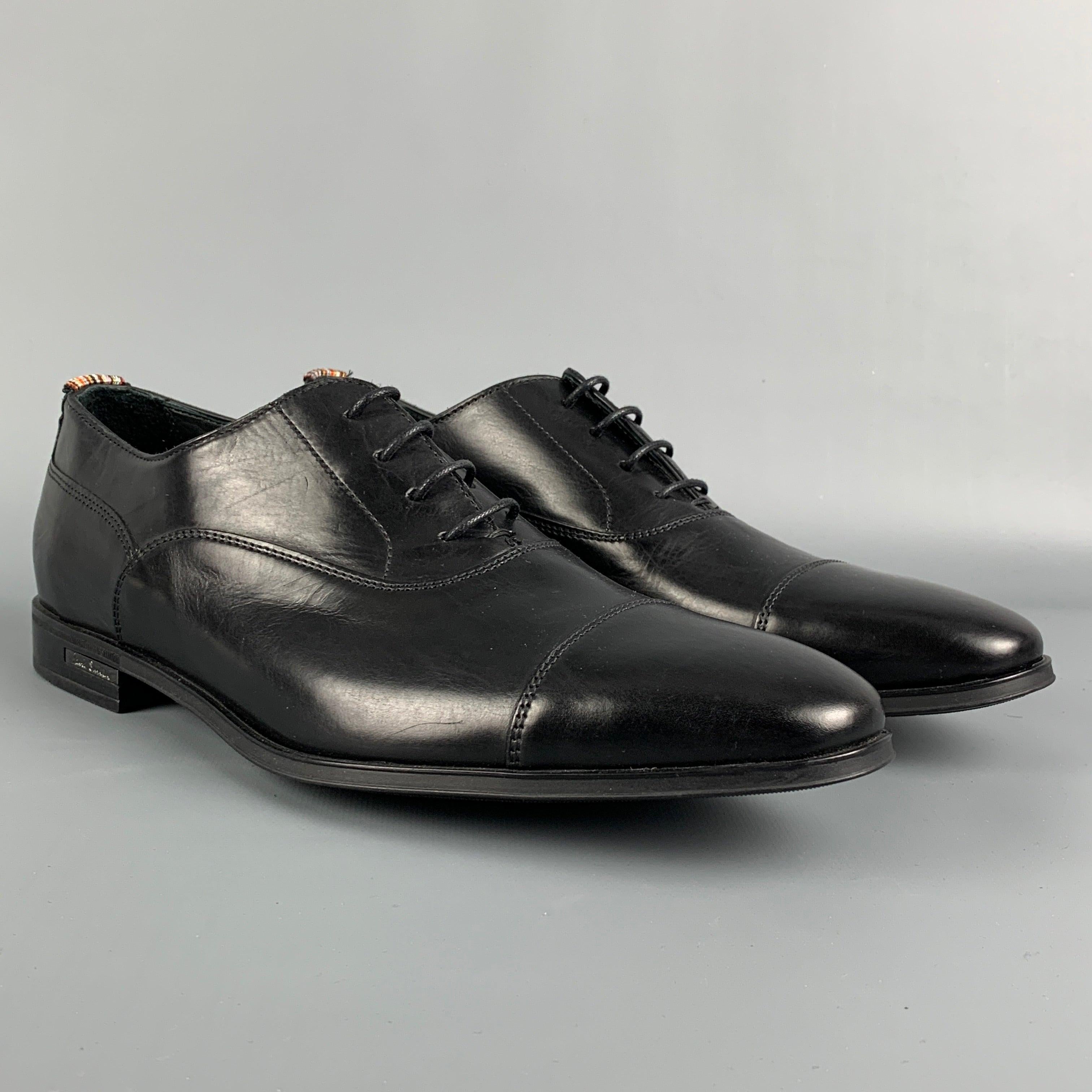 PAUL SMITH dress shoes comes in a black leather featuring a cap toe and a lace up closure. Made in Italy.
Very Good
Pre-Owned Condition. 

Marked:   V204 7 41Outsole: 11.5 inches  x 4 inches 
  
  
 
Reference: 113840
Category: Lace Up Shoes
More