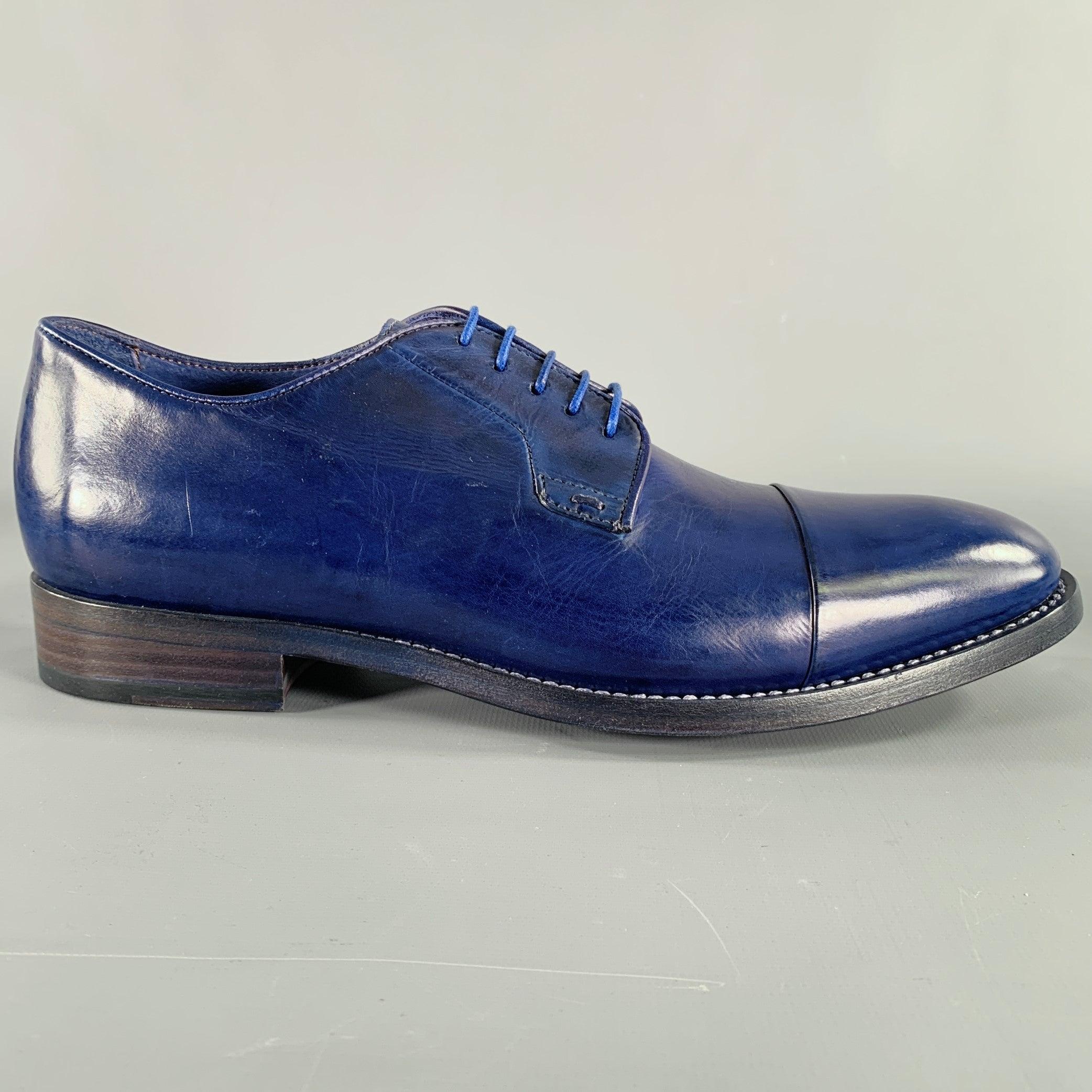 PAUL SMITH shoes
in a blue leather fabric featuring a derby style, cap toe, and lace-up closure. Made in Italy.Very Good Pre-Owned Condition. Minor signs of wear. 

Marked:   S006 7 41Outsole:11 inches  x 4 inches 
  
  
 
Sui Generis Reference: