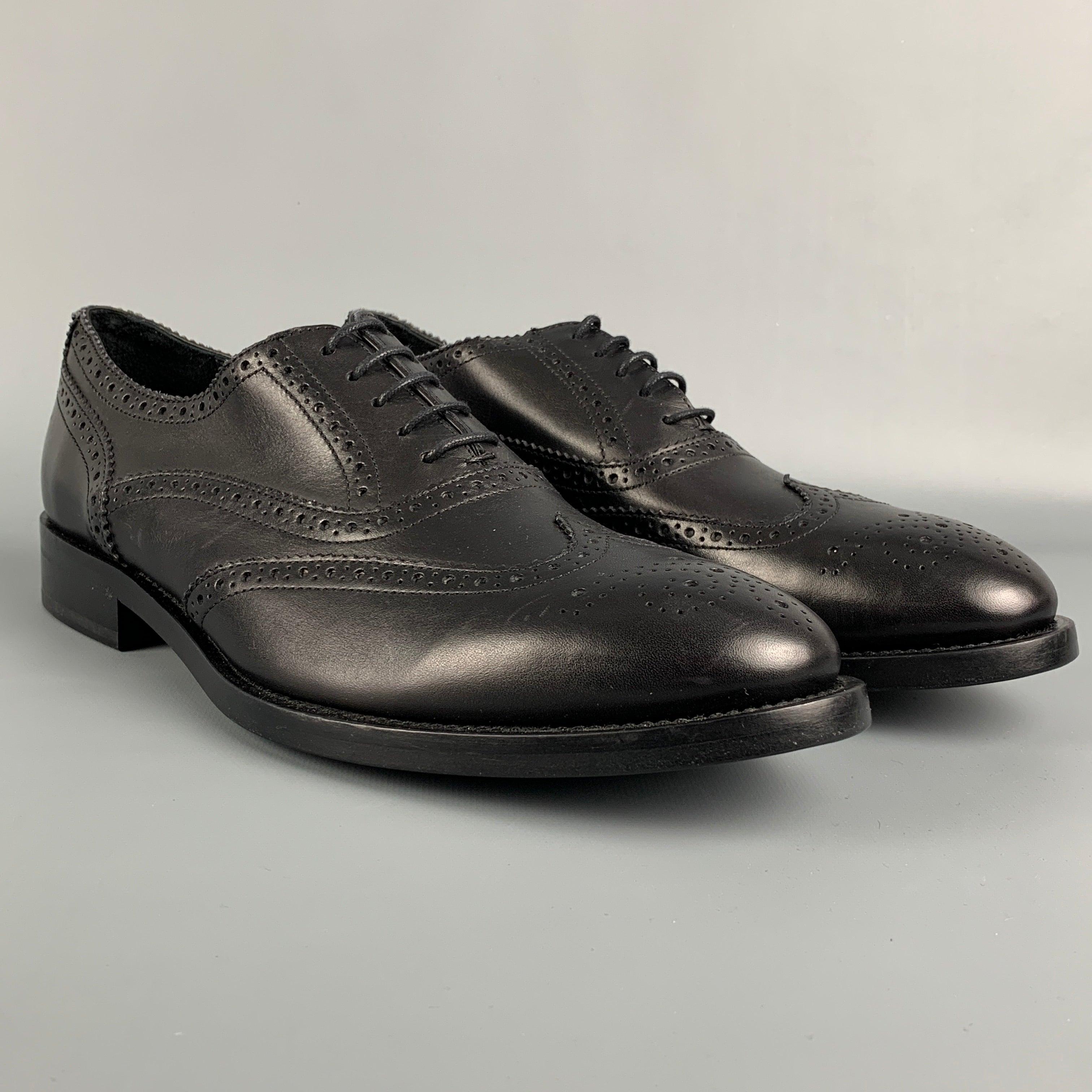 PAUL SMITH shoes comes in a black perforated leather featuring a wingtip style and a lace up closure. Made in Italy.
Excellent
Pre-Owned Condition. 

Marked:   8Outsole: 12 inches  x 4 inches 
  
  
 
Reference: 113838
Category: Lace Up Shoes
More