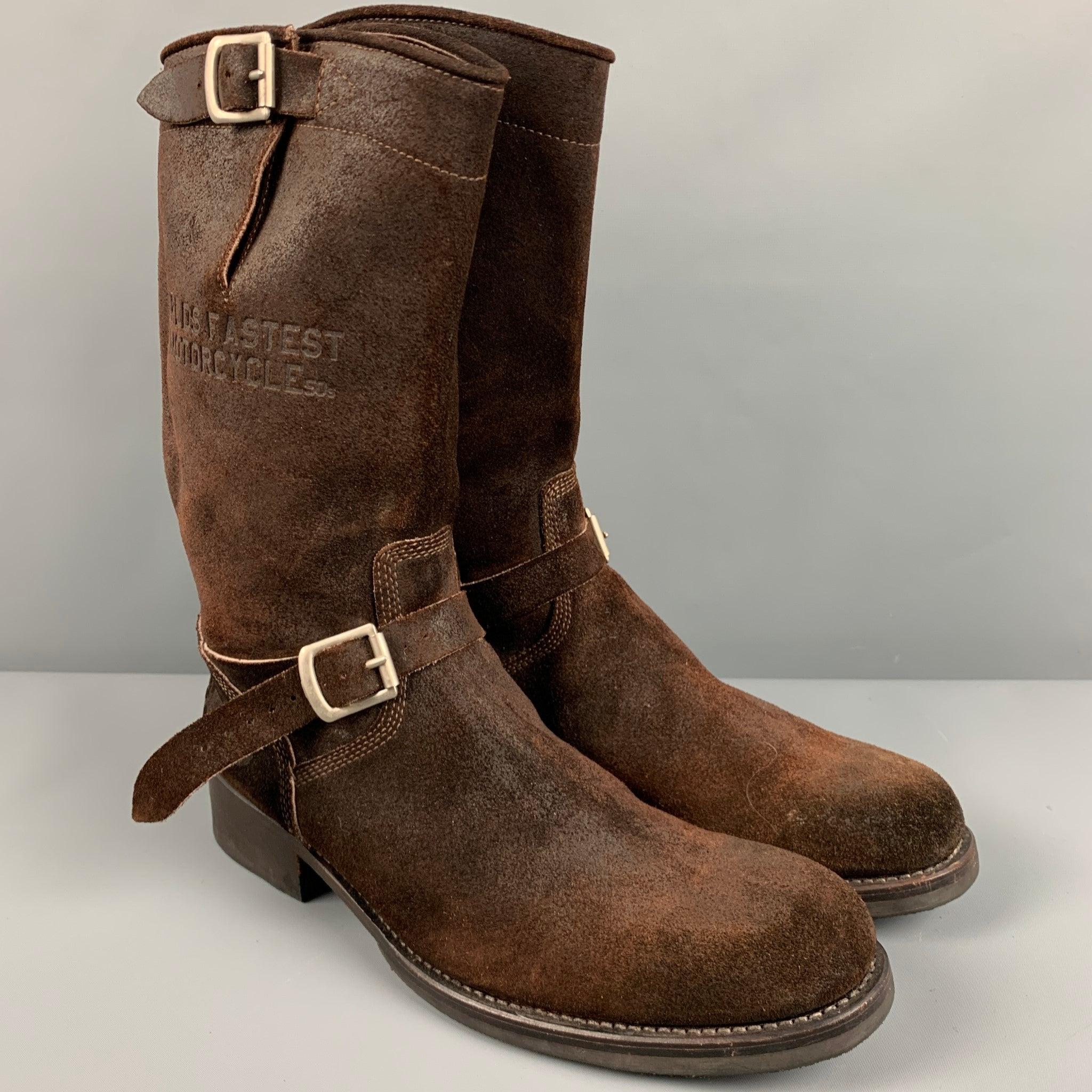 TRIUMPH by PAUL SMITH boots
in a brown leather fabric featuring pull on style, embossed text, silver tone buckles, and heavy duty soles. Made in Italy.Very Good Pre-Owned Condition. 

Marked:   3461 42 8 

Measurements: 
  Length: 12 inches Width:
