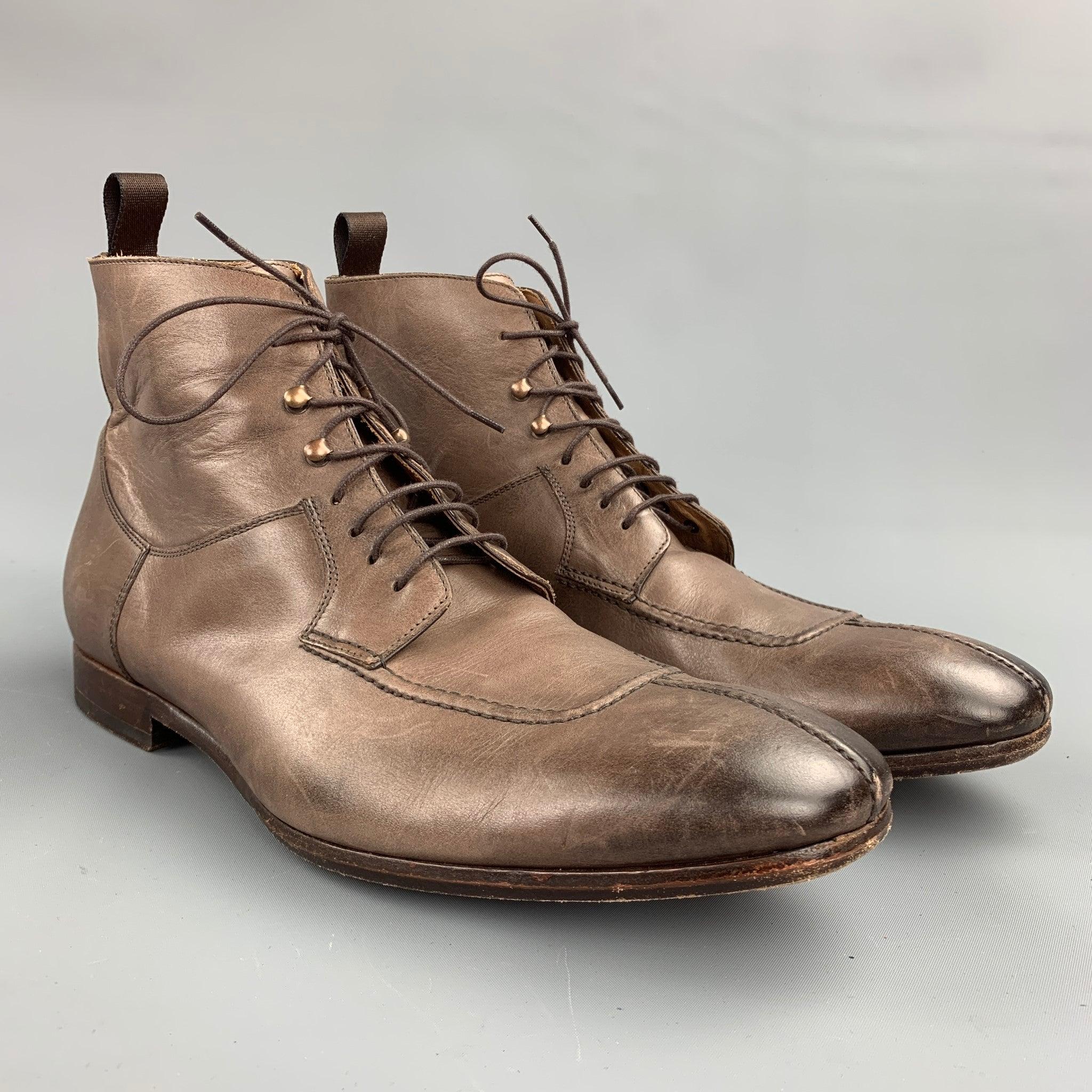 PAUL SMITH ankle boots comes in a brown distressed leather featuring a cap toe, top stitching, wooden sole, and a lace up closure. Minor wear. Made in Italy.Good Pre-Owned Condition. 

Marked:   EU 43.5 

Measurements: 
  Width: 4 inches 
Length: 12