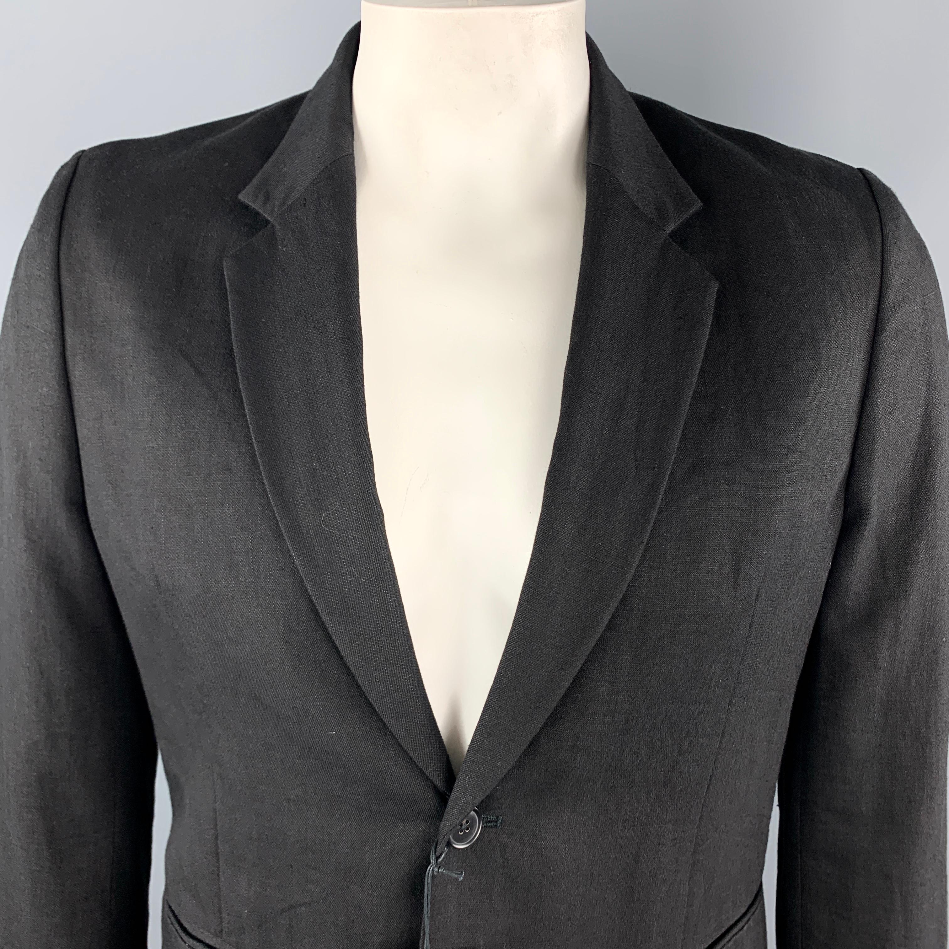 PAUL SMITH Sport Coat comes in a solid black linen / wool material, with a notch lapel, slit pockets, a single button at closure, single breasted, unbuttoned cuffs, unlined. Made in Italy.

New with Tags.
Marked: No size

Measurements:

Shoulder: 17