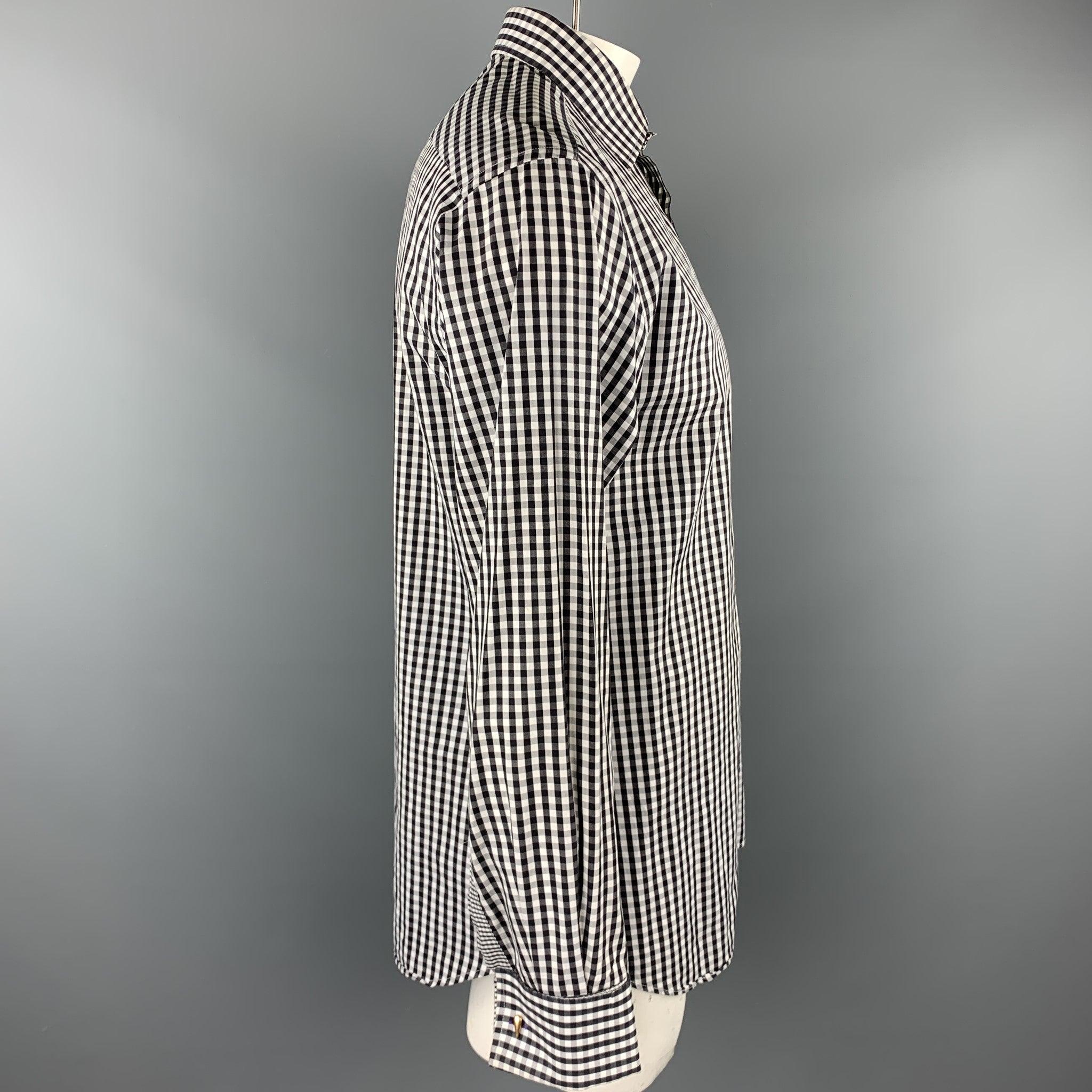 PAUL SMITH long sleeve shirt comes in a black and white checkered cotton featuring a slim fit, french cuffs, and a spread collar. Cuff links not included. Made in Italy.Excellent
Pre-Owned Condition. 

Marked:   16.5/42 

Measurements: 
 
Shoulder: