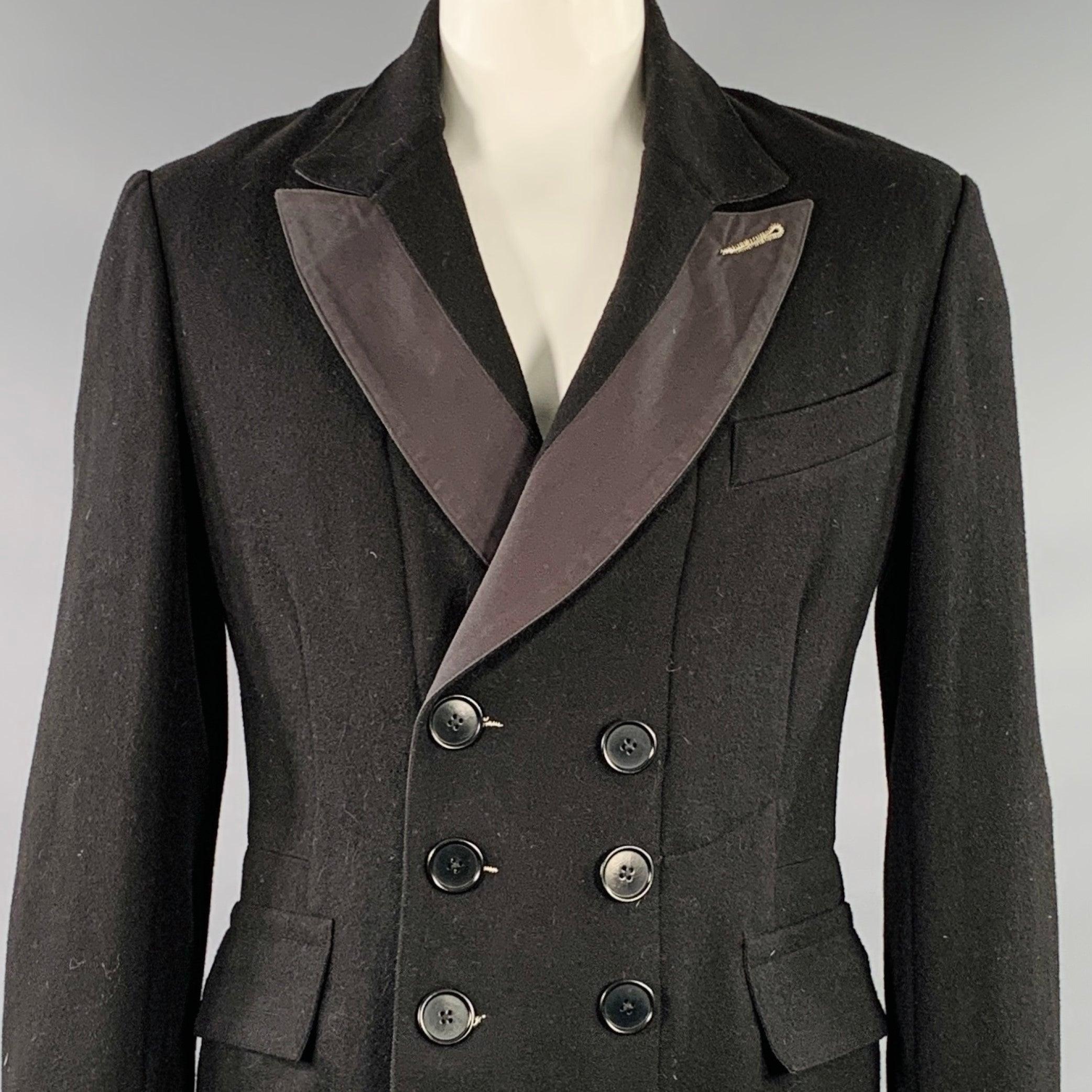 PAUL SMITH coat
in a
black wool nylon blend fabric featuring a peak lapel, double breasted style, and button closure. Very Good Pre-Owned Condition. Moderate mark on cuff. 

Marked:   L 

Measurements: 
 
Shoulder: 18.5 inches Chest: 42 inches