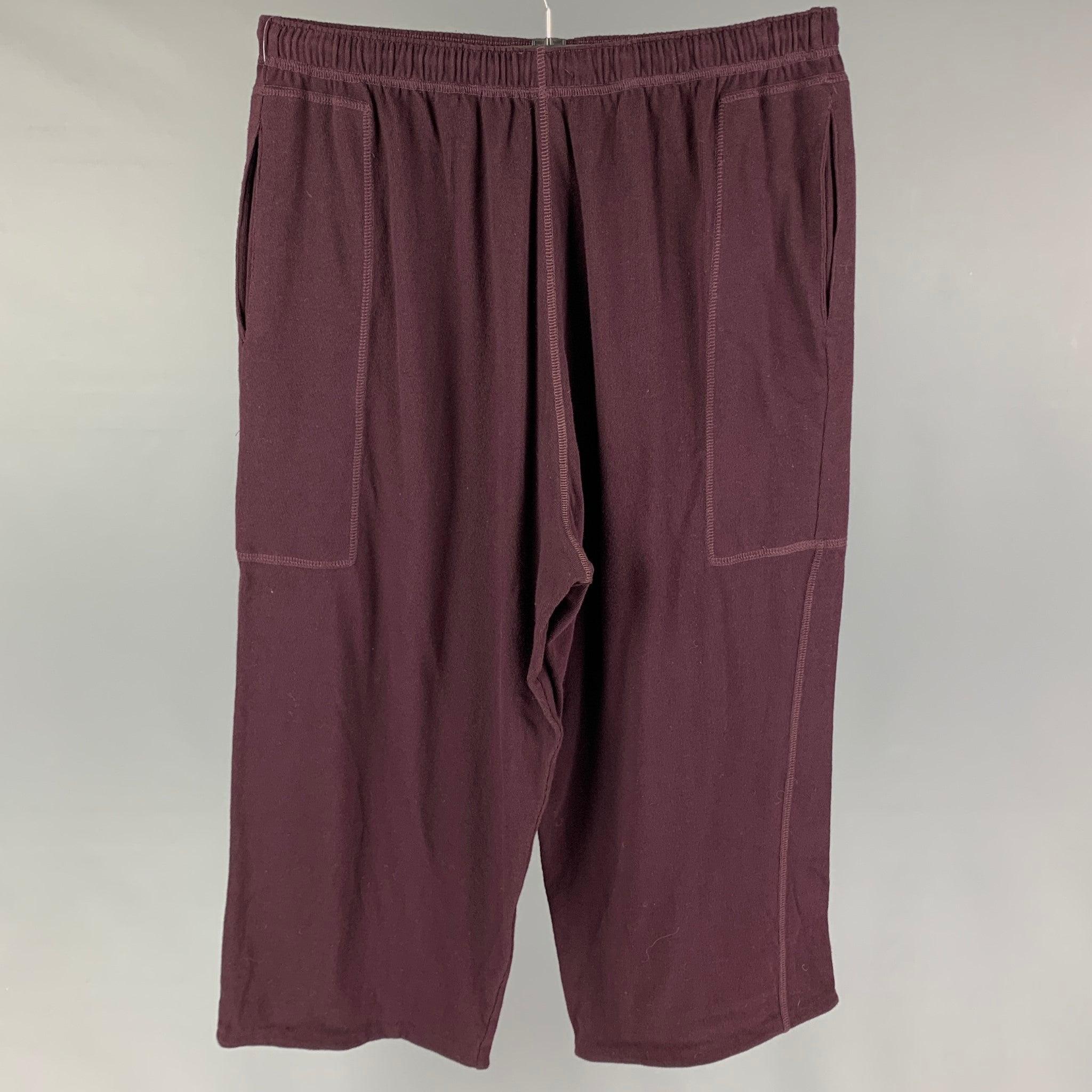 PAUL SMITH pants comes in a burgundy cotton featuring a loose fit, cropped, and a elastic waist. Made in England.
Very Good
Pre-Owned Condition. 

Marked:   L  

Measurements: 
  Waist: 30 inches  Rise: 16.5 inches  Inseam: 23 inches 
  
  
