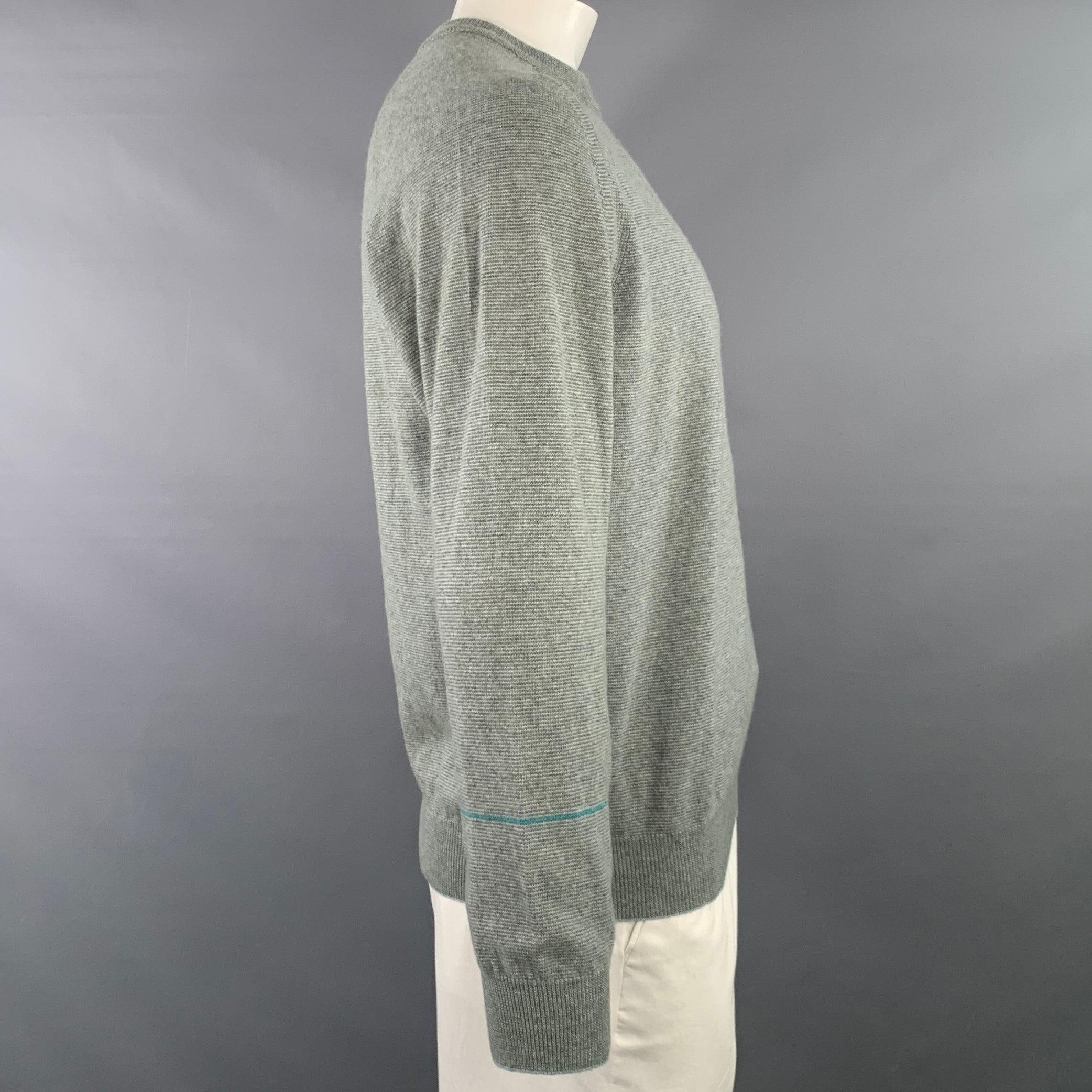 PAUL SMITH pullover
in a grey lambswool cotton blend knit featuring long sleeves, multicolor striped square detail on back, and crew neck. Made in Italy.Excellent Pre-Owned Condition. 

Marked:   L 

Measurements: 
 
Shoulder: 15.5 inches Chest: 46