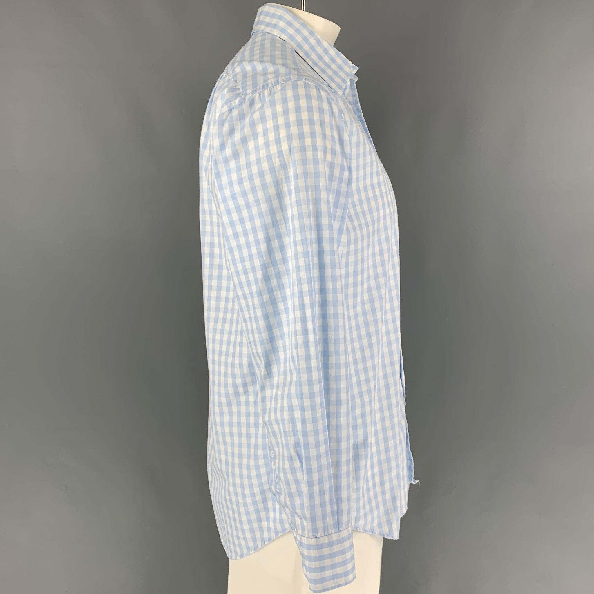PAUL SMITH long sleeve shirt comes in a light blue & white gingham cotton featuring a spread collar, patch pocket, and a button up closure.
Very Good
Pre-Owned Condition. 

Marked:   16/41 

Measurements: 
 
Shoulder: 19 inches  Chest: 44 inches 