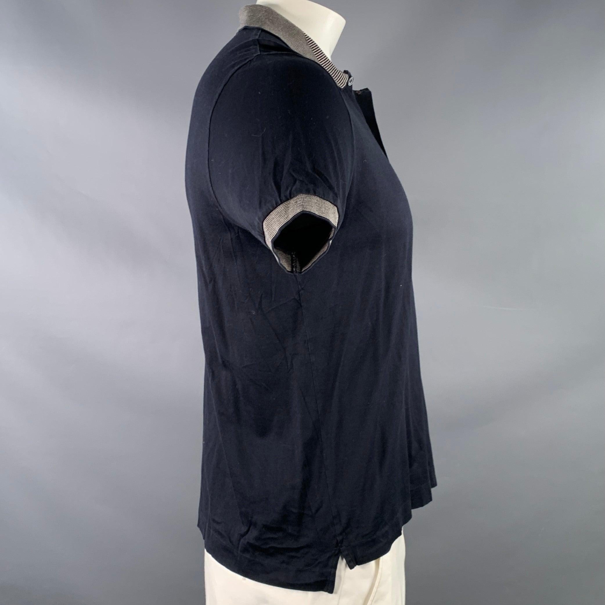 PAUL SMITH polo
in a
navy cotton jersey featuring contrasting grey stripe trim, short sleeves, and half placket button closure.Excellent Pre-Owned Condition. 

Marked:   L 

Measurements: 
 
Shoulder: 16.5 inches Chest: 42 inches Sleeve: 8.5 inches
