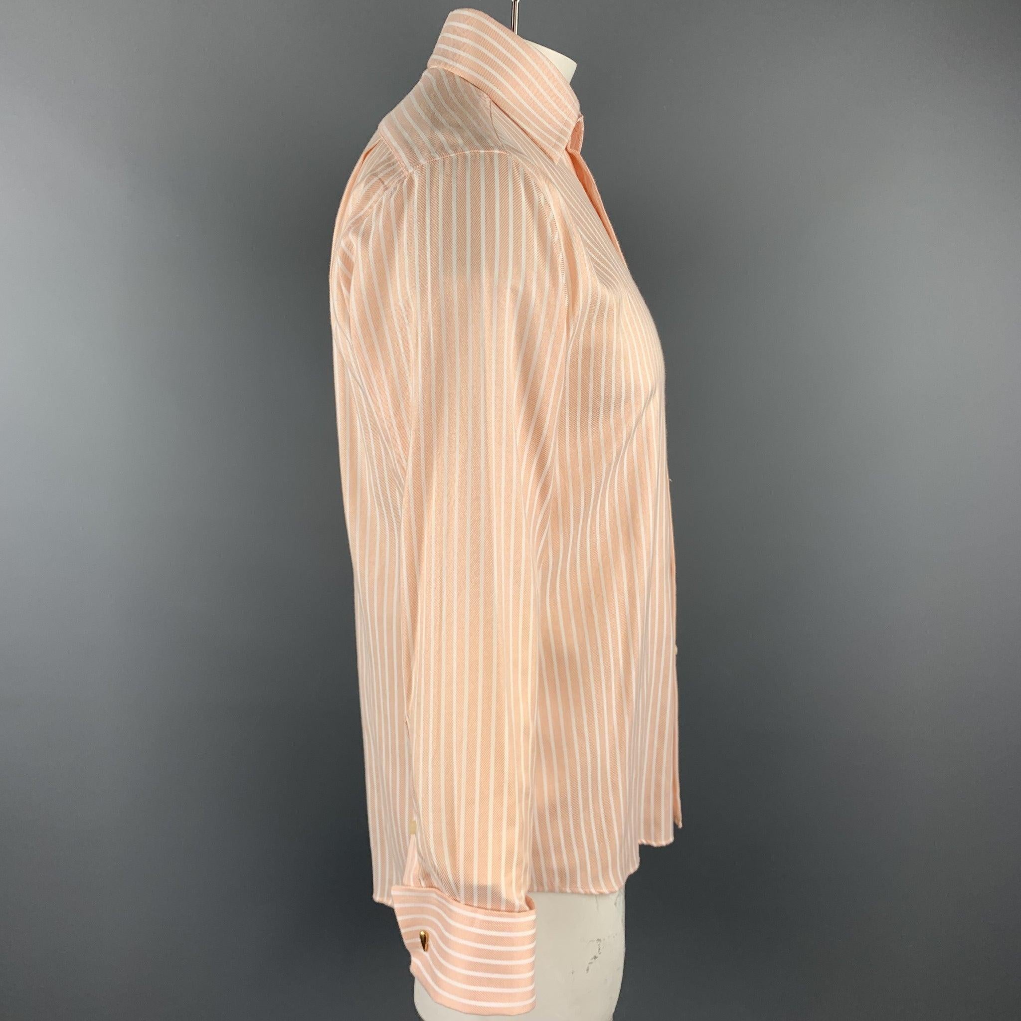PAUL SMITH long sleeve shirt comes in a peach cotton with white stripes featuring a button up style, cuff link sleeves, and a spread collar. Cuff links not included.
Very Good
Pre-Owned Condition. 

Marked:   16.5/33-34 

Measurements: 
 
Shoulder: