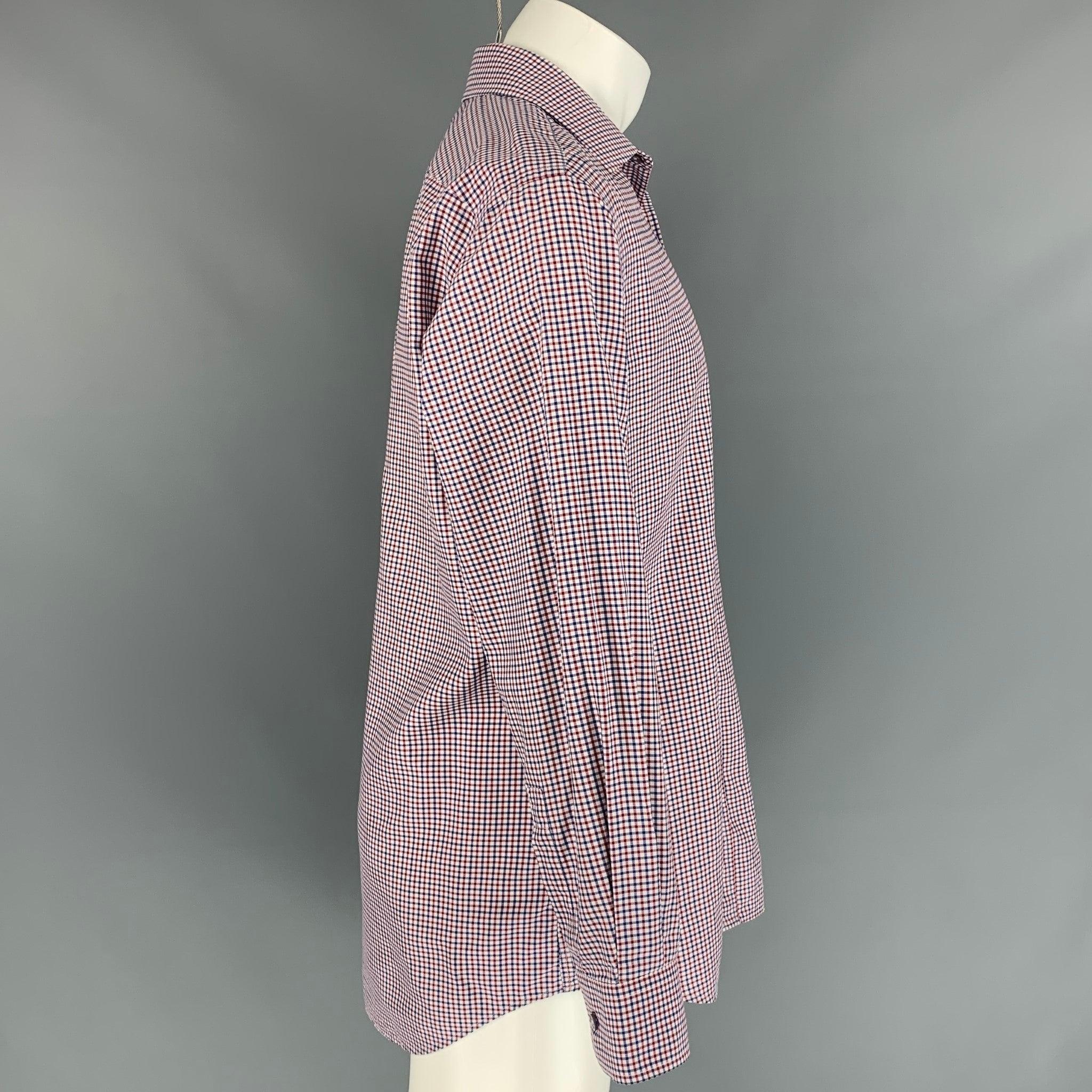 PAUL SMITH long sleeve shirt comes in a red & blue checkered cotton featuring a classic fit, spread collar, and a buttoned closure. Made in Italy.
Very Good
Pre-Owned Condition. 

Marked:   16.5/39 

Measurements: 
 
Shoulder: 19 inches  Chest: 44