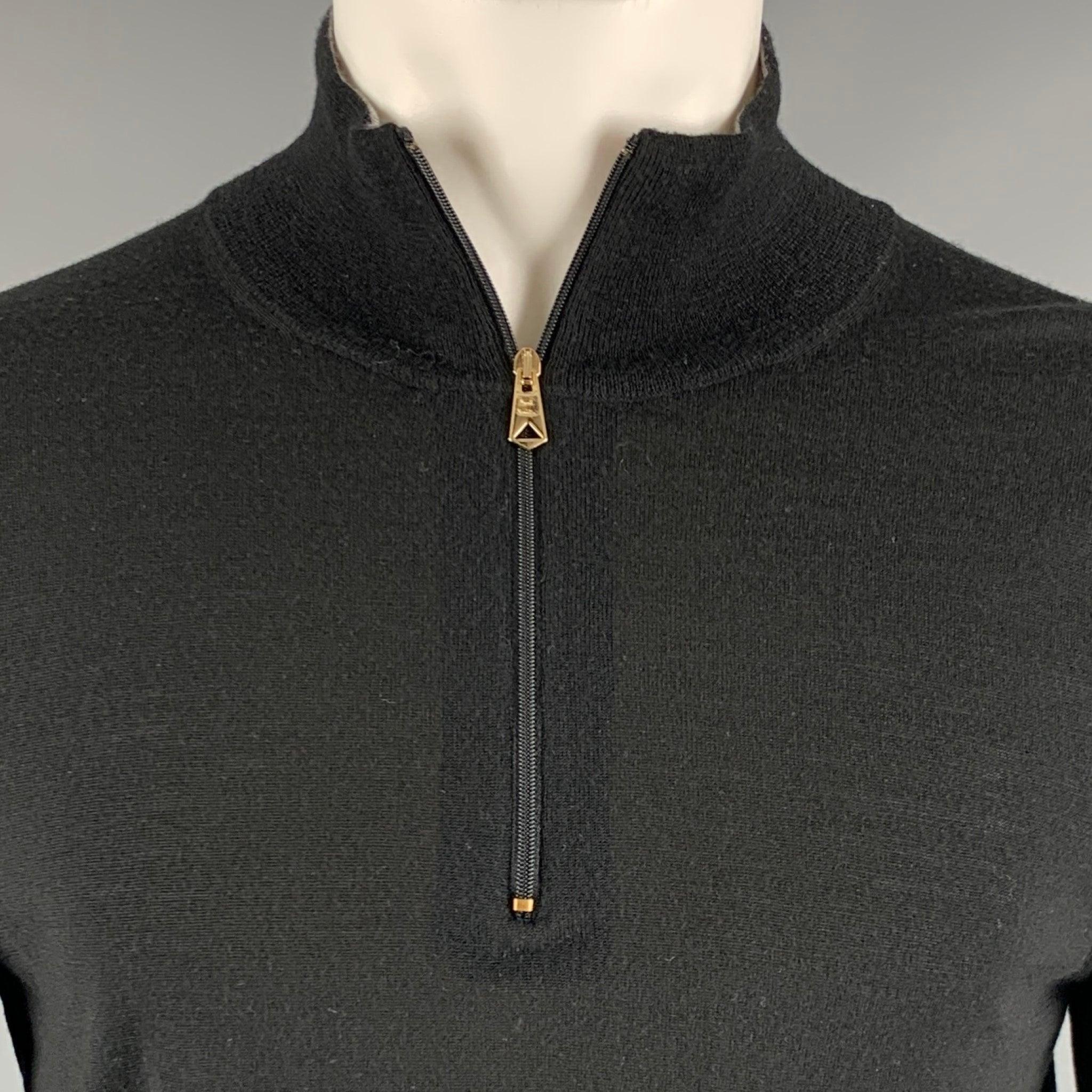 PAUL SMITH pullover
in a black merino wool fabric featuring half placket zip up closure with gold tone hardware.Good Pre-Owned Condition. Moderate signs of wear, please check photos. 

Marked:   S 

Measurements: 
 
Shoulder: 16.5 inches Chest: 39