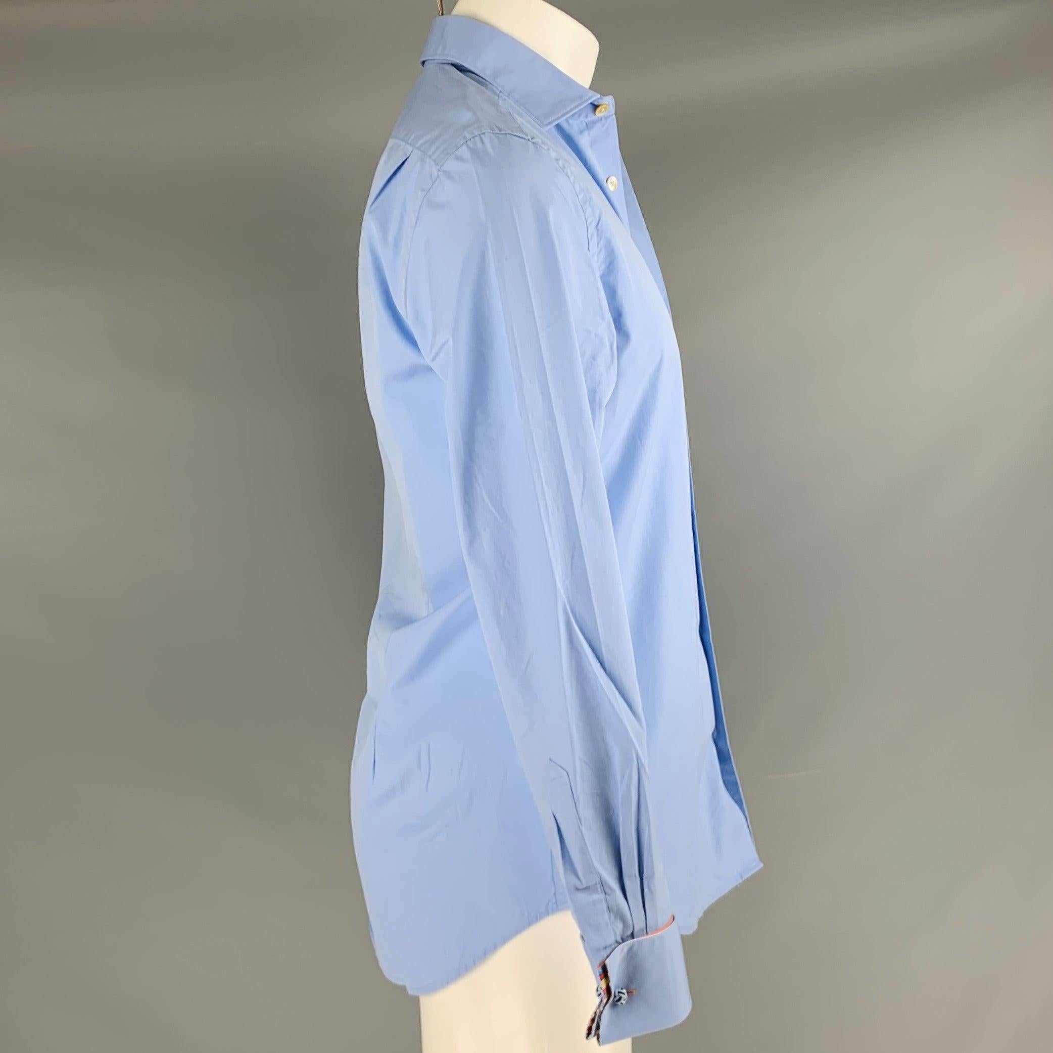 PAUL SMITH long sleeve shirt
in a blue cotton woven fabric featuring spread collar, French cuffs, and button closure. Comes with cufflinks. Made in Italy.Excellent Pre-Owned Condition. 

Marked:   15