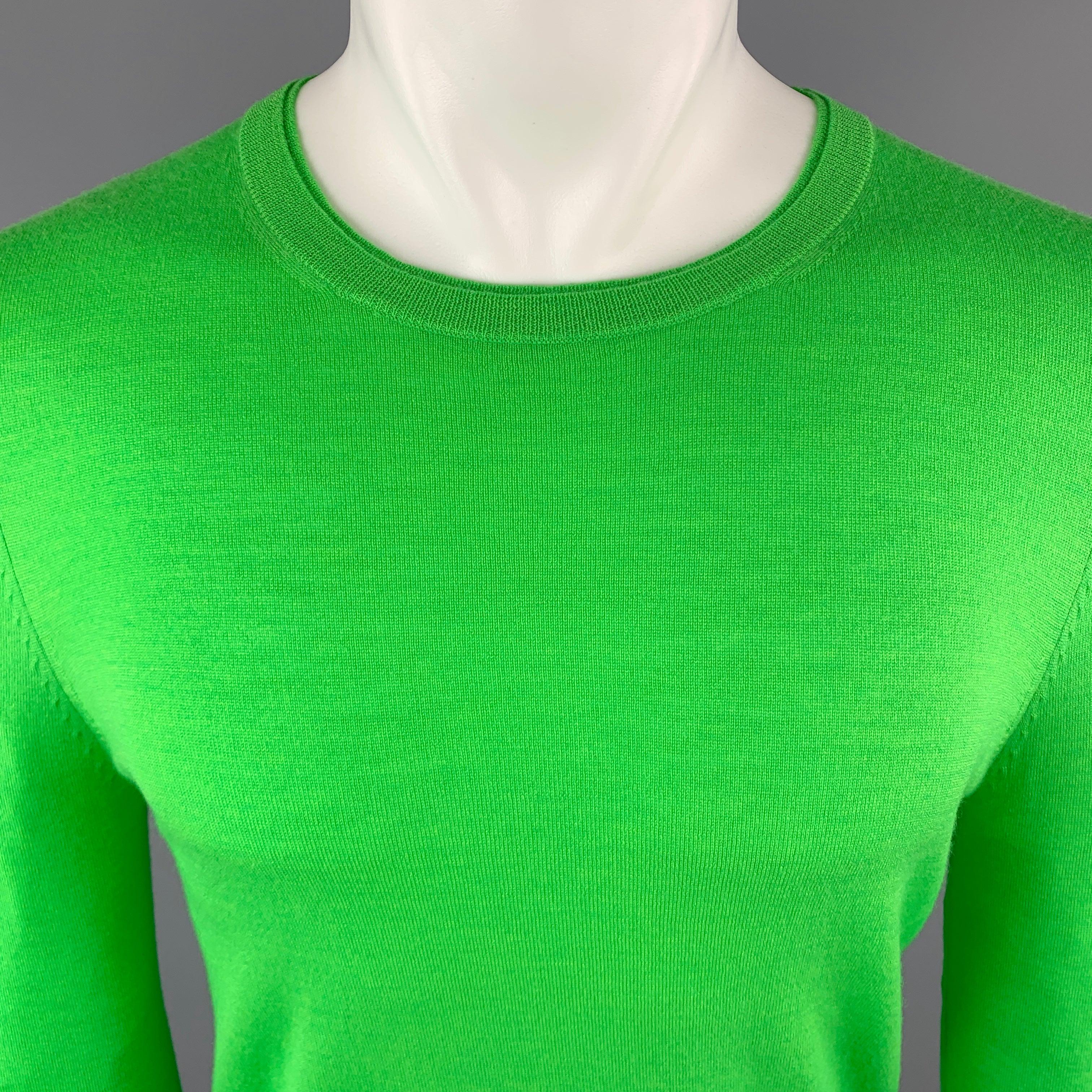 PAUL SMITH Pullover Sweater comes in a brilliant green tone in a solid merino wool material, with a crewneck, and ribbed cuffs and hem. Made in Belgium.New with Tags. 

Marked:   S 

Measurements: 
 
Shoulder: 16 inches 
Chest: 39 inches 
Sleeve: 29