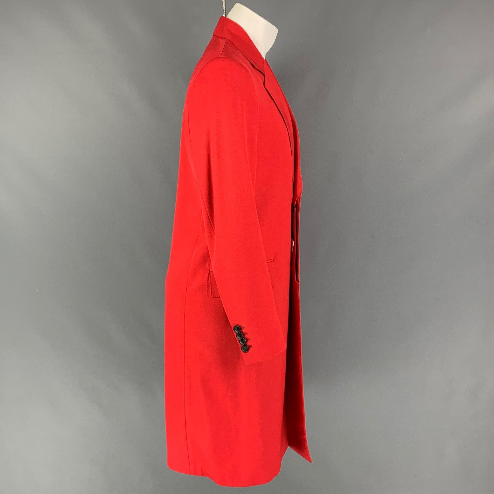 PAUL SMITH coat comes in a red wool / polyamide featuring a notch lapel, flap pockets, single back vent, and a hidden placket closure. Made in Italy.
New With Tags.
 

Marked:  S 

Measurements: 
 
Shoulder: 17 inches Chest: 38 inches Sleeve: 27