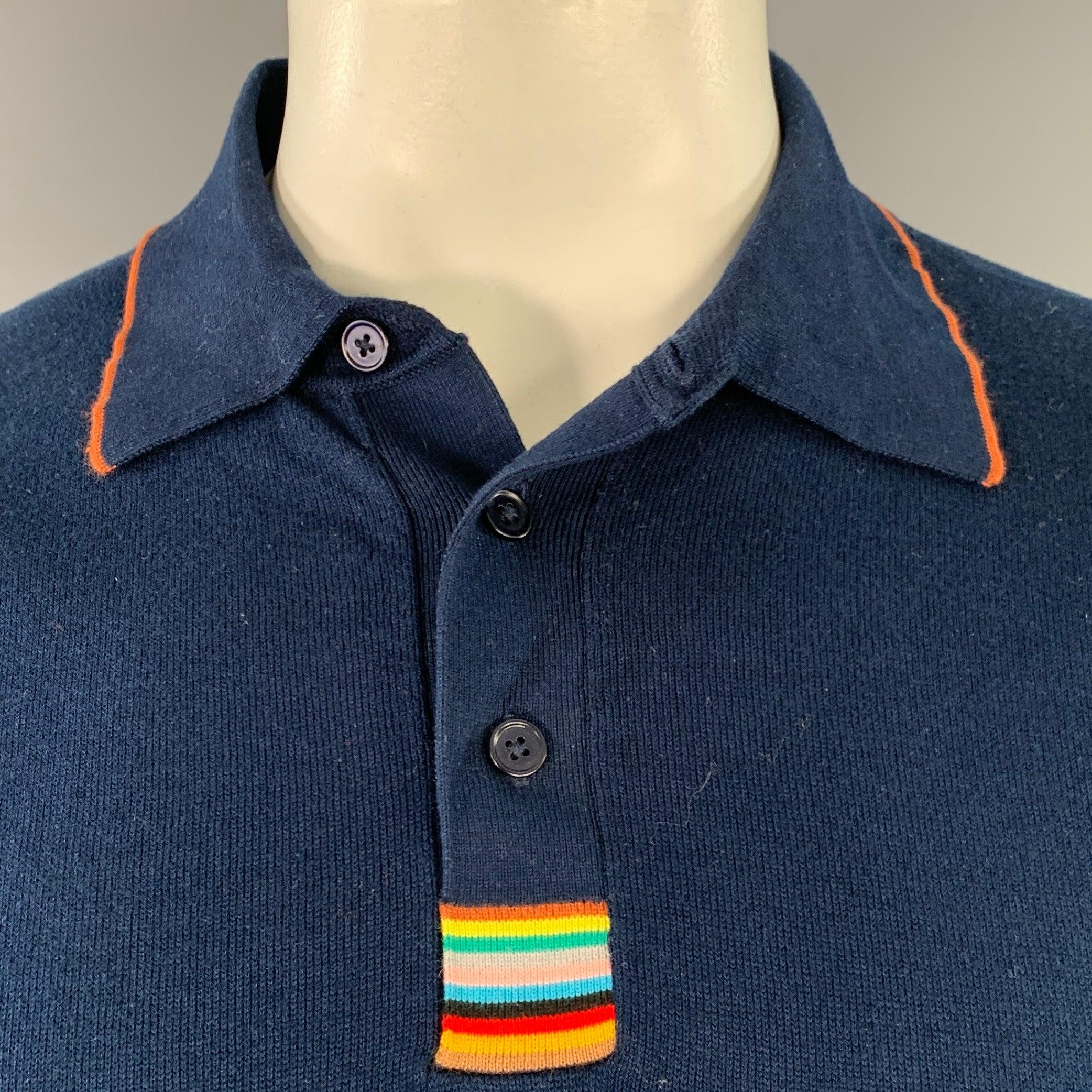 PAUL SMITH polo
in a navy cotton featuring contrasting orange trim, short sleeves, and half placket button closure with multi-color striped detail.Excellent Pre-Owned Condition. 

Marked:   XL 

Measurements: 
 
Shoulder: 18 inches Chest: 46 inches