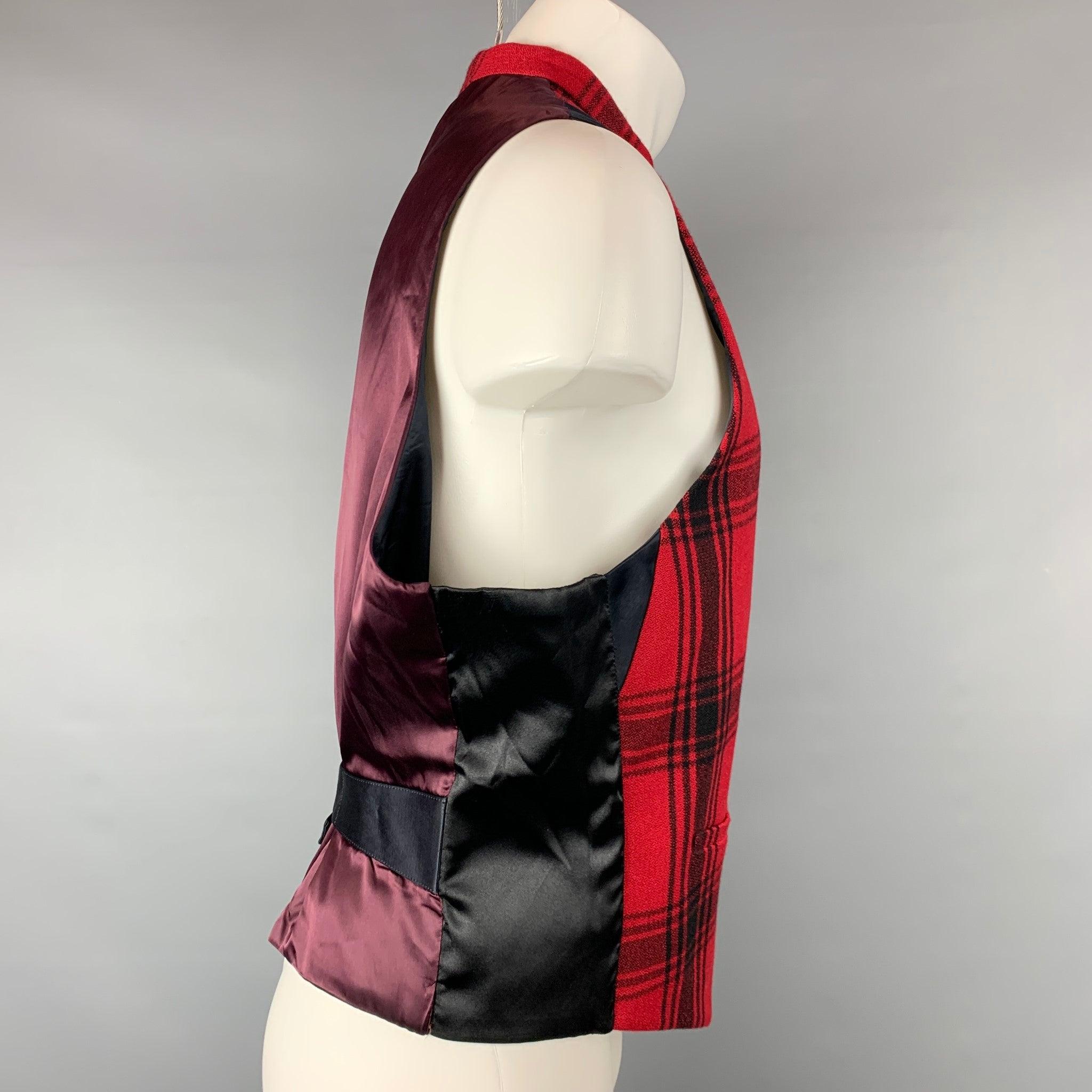 PAUL SMITH vest comes in a red & black plaid wool with a full liner featuring slit pockets, back belt, and a buttoned closure. Very Good Pre-Owned Condition. 

Marked:   XL 

Measurements: 
 
Shoulder: 14.5 inches  Chest: 46 inches  Length: 22.5