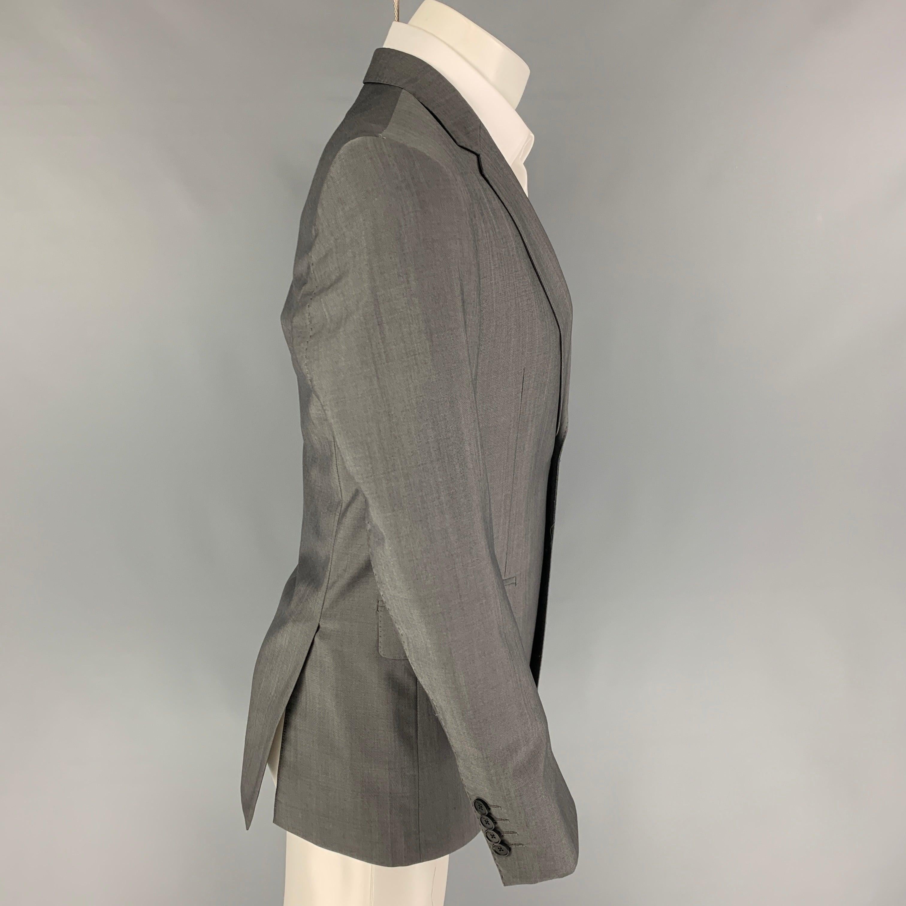 PAUL SMITH 'The Byard' sport coat comes in a grey wool / mohair with a full liner featuring a notch lapel, flap pockets, double back vent, and a double button closure. Made in Italy.
Very Good
Pre-Owned Condition. 

Marked:   36 

Measurements: 
