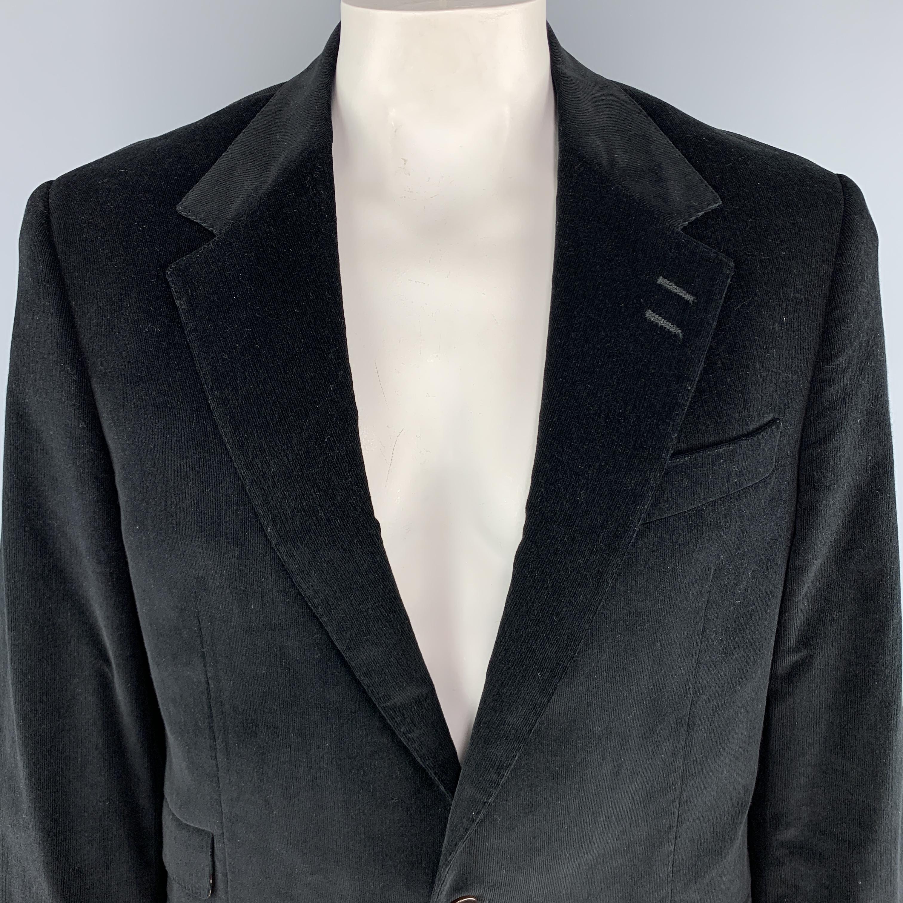PAUL SMITH The Westbourne Sport Coat comes in a black tone in a solid corduroy material, with a notch lapel, slit and flap pockets, two buttons at closure, single breasted, buttoned cuffs, and a single vent at back. Made in Italy. 

Excellent