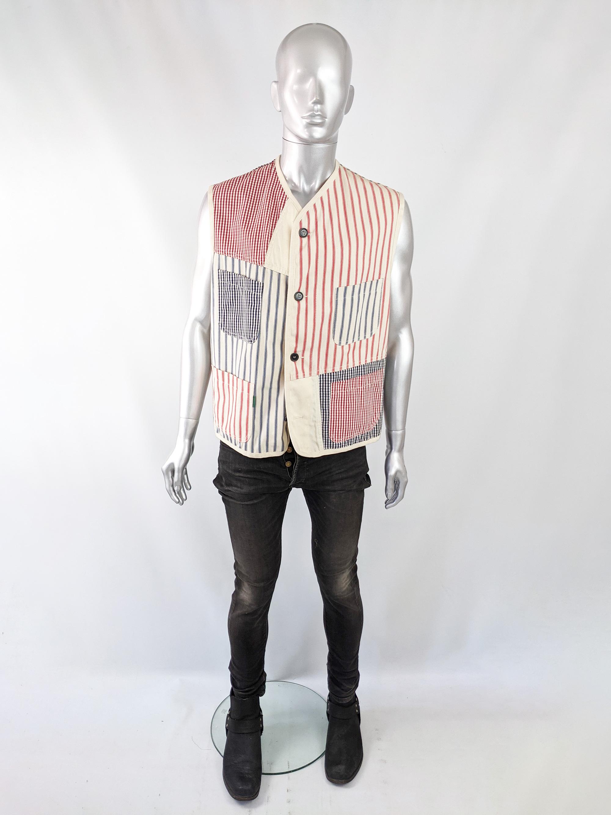 An amazing vintage mens Paul Smith sleeveless jacket from the 90s. In an off-white cotton canvas with a patchwork of stripes and gingham / picnic check panels throughout. 


Size: Marked Large
Chest - 48” / 122cm
Waist - 46” / 117cm
Length (Shoulder