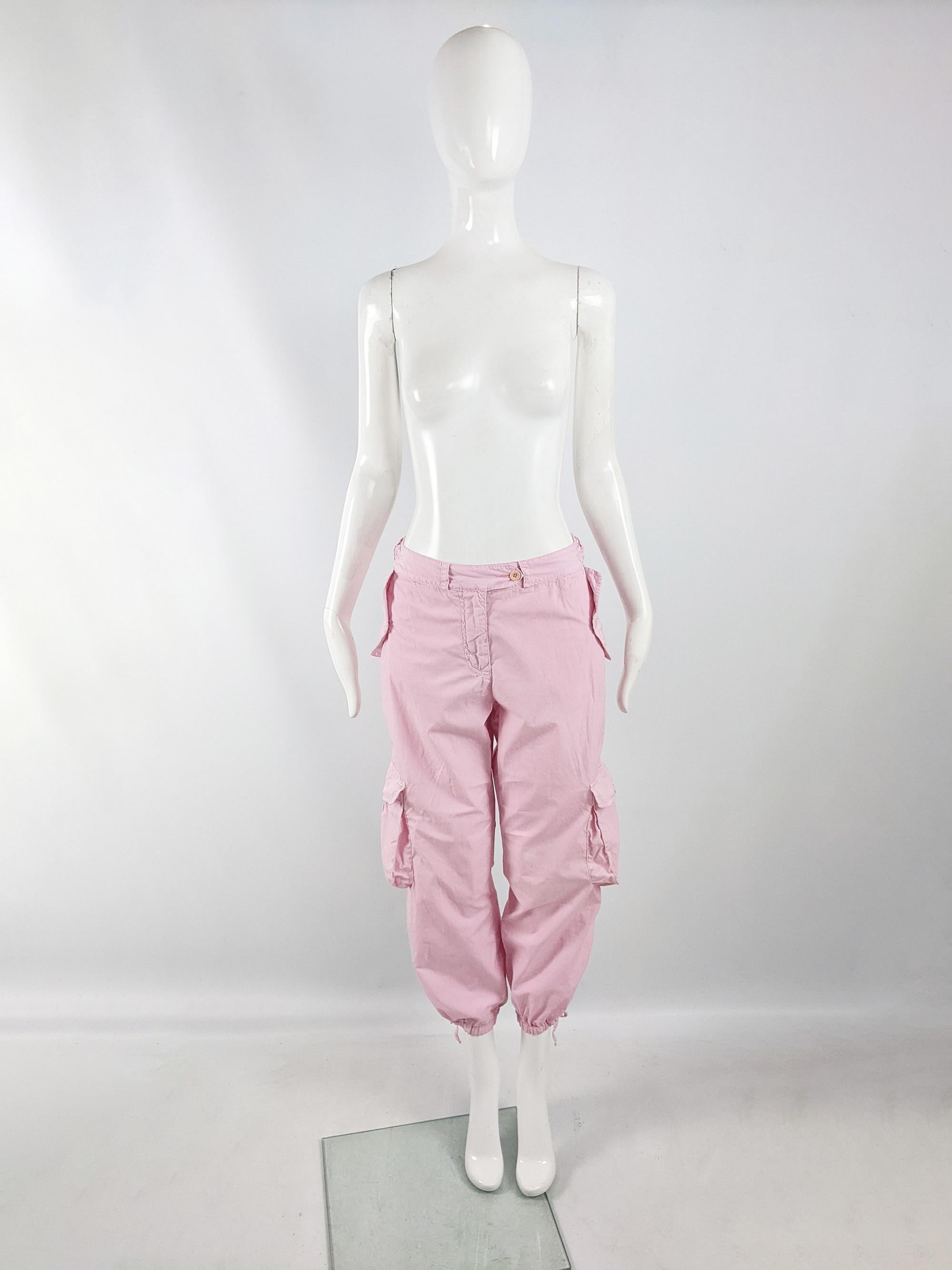 An incredible pair of vintage parachute pants from the early 2000s by luxury British fashion designer, Paul Smith. Made in Italy, from a pastel pink cotton with a baggy fit, cropped leg and large patch pockets. It has great detailing from the O