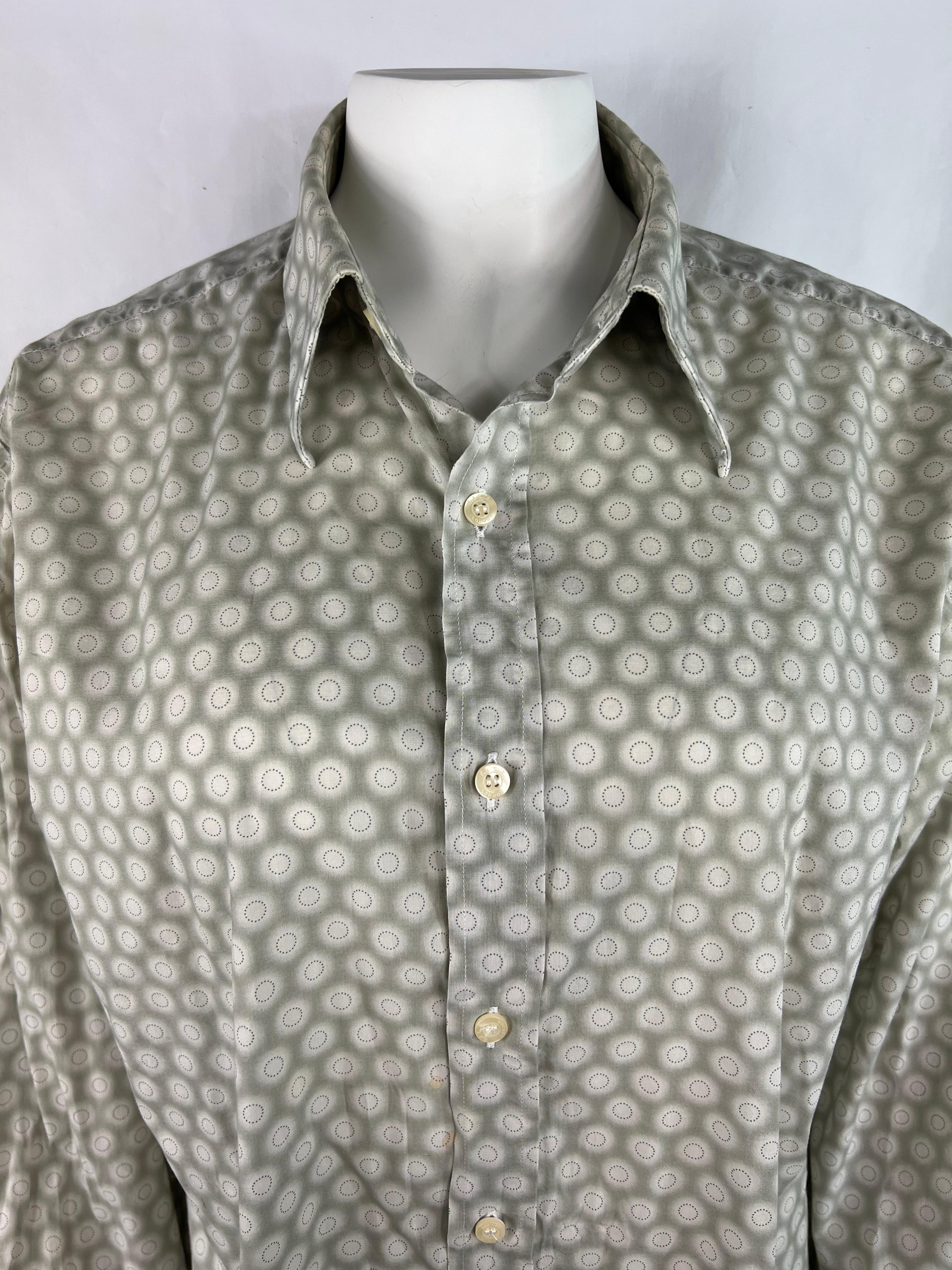 Product details:

The shirt features front button down closure and geometric print. Made in Italy.