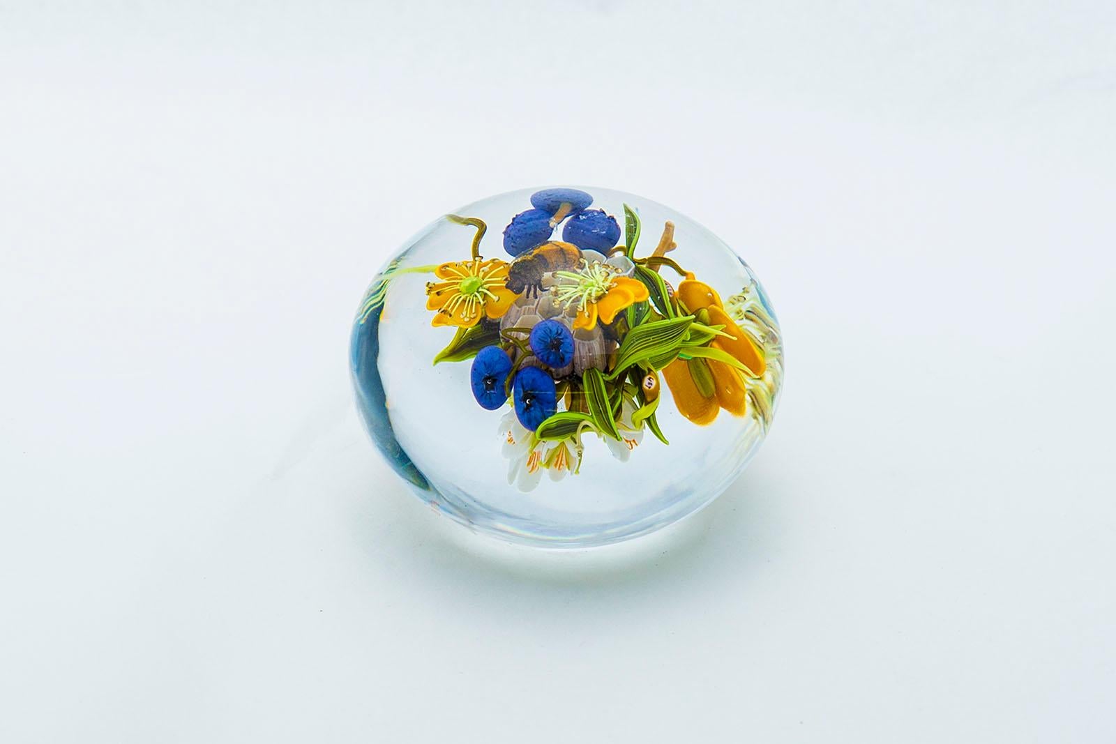 Artist: Paul Stankard
Title: Paul Stankard Paperweight Seeds Cane and Yellow Lillys with Wildflowers and Bursting seed Pots
Size: 3.5