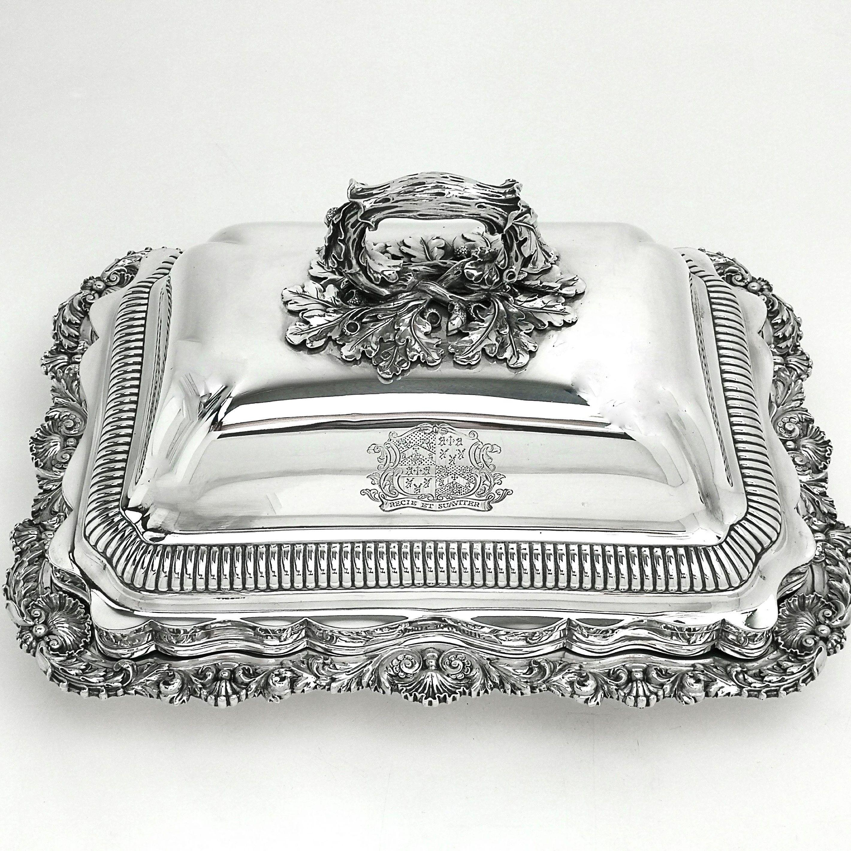 A wonderful Paul Storr Georgian Silver Entree Dish with a shell and foliate border on the base Dish. The Entree Dish has an impressive domed lid with a large handle in the shape of a bent branch and leaves.The Lid has a Crest engraved on the one