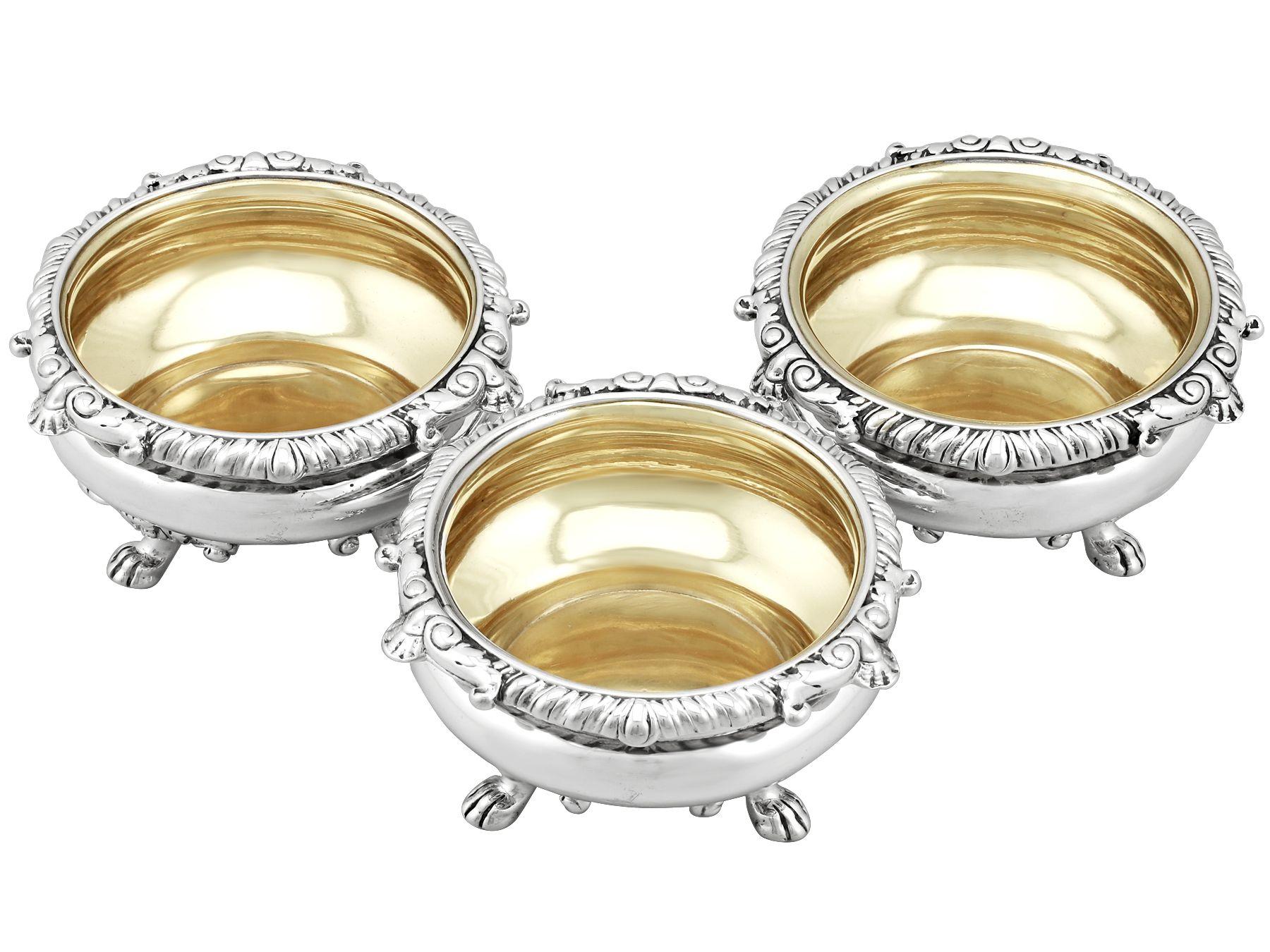 An exceptional, fine and impressive set of three antique Georgian English sterling silver salts made by Paul Storr; an addition to our silver cruet and condiment collection.

These exceptional antique George III sterling silver salts have a