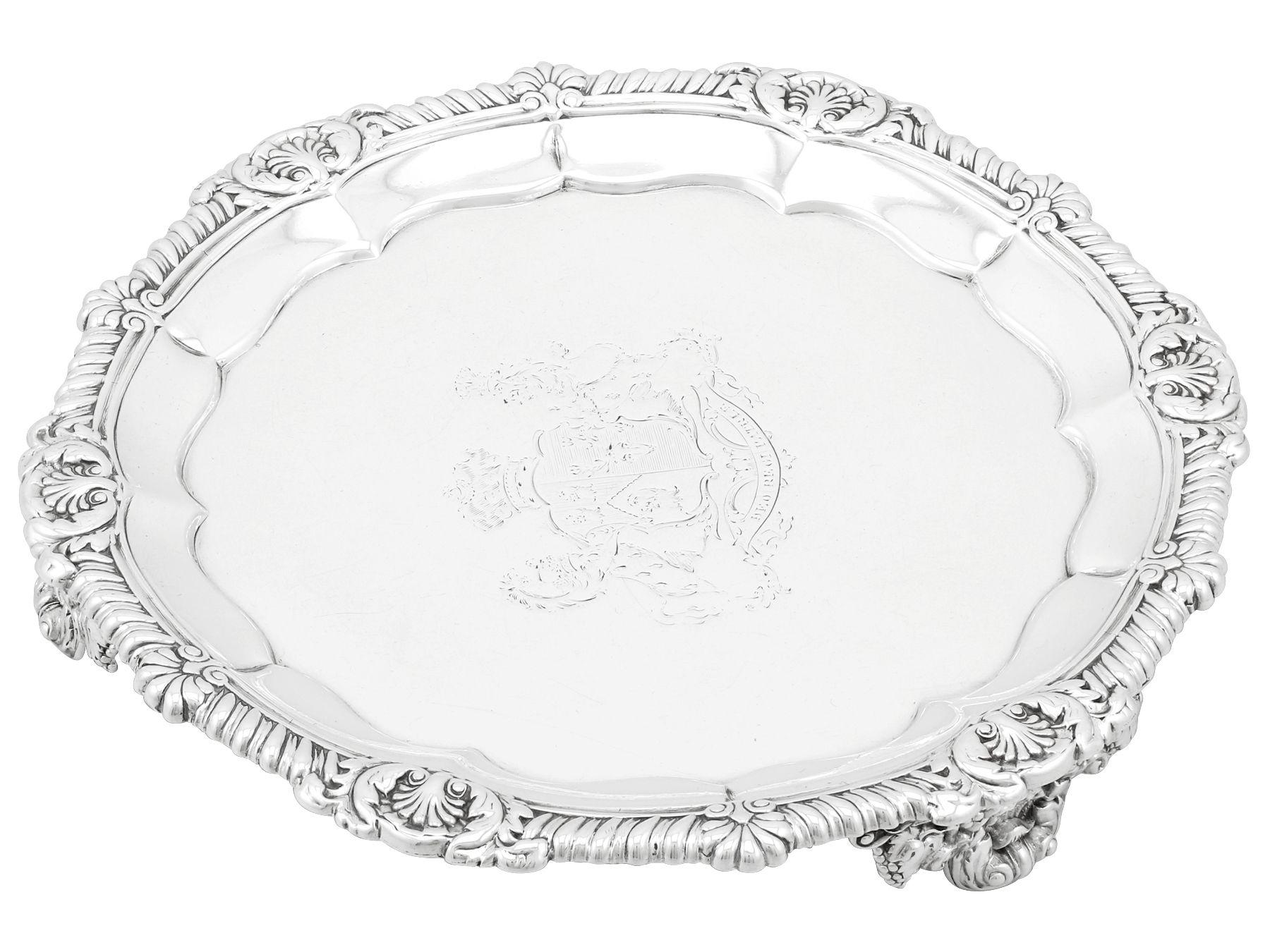 An exceptional, fine and impressive antique George IV English sterling silver salver made by Paul Storr; an addition to our range of collectable silverware.

This exceptional antique sterling silver salver has a plain circular shaped form.

The