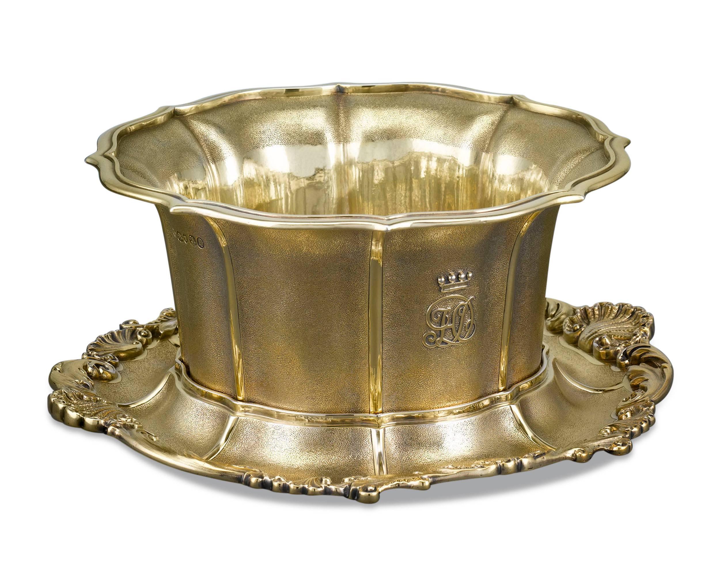 This rare and exceptional William IV bowl is the work of preeminent Georgian silversmith Paul Storr. Crafted of luxurious gilt silver, the bowl exhibits all the hallmarks of Storr’s celebrated style, from the textured panels and applied decorations