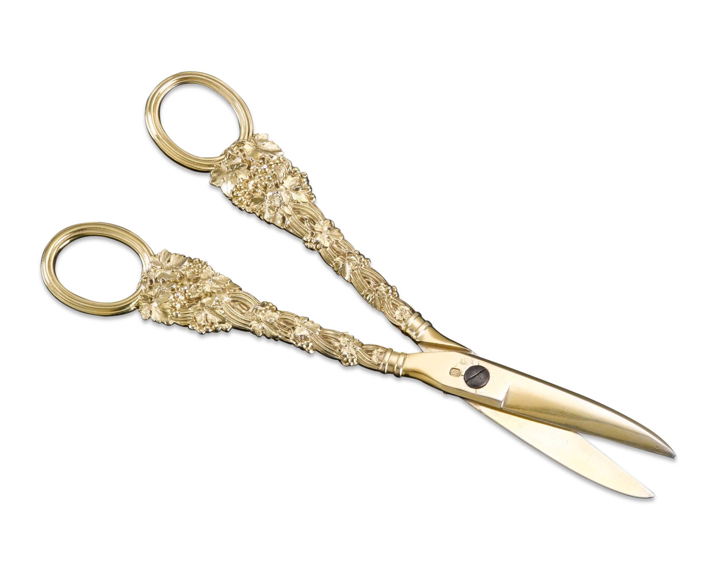 An incredibly rare and exceptional pair of grape shears by Paul Storr, one of the most esteemed silversmiths in history. With handles laden with grapevines, this pair of intricate silver-gilt shears is an uncommon item in Storr's extraordinary