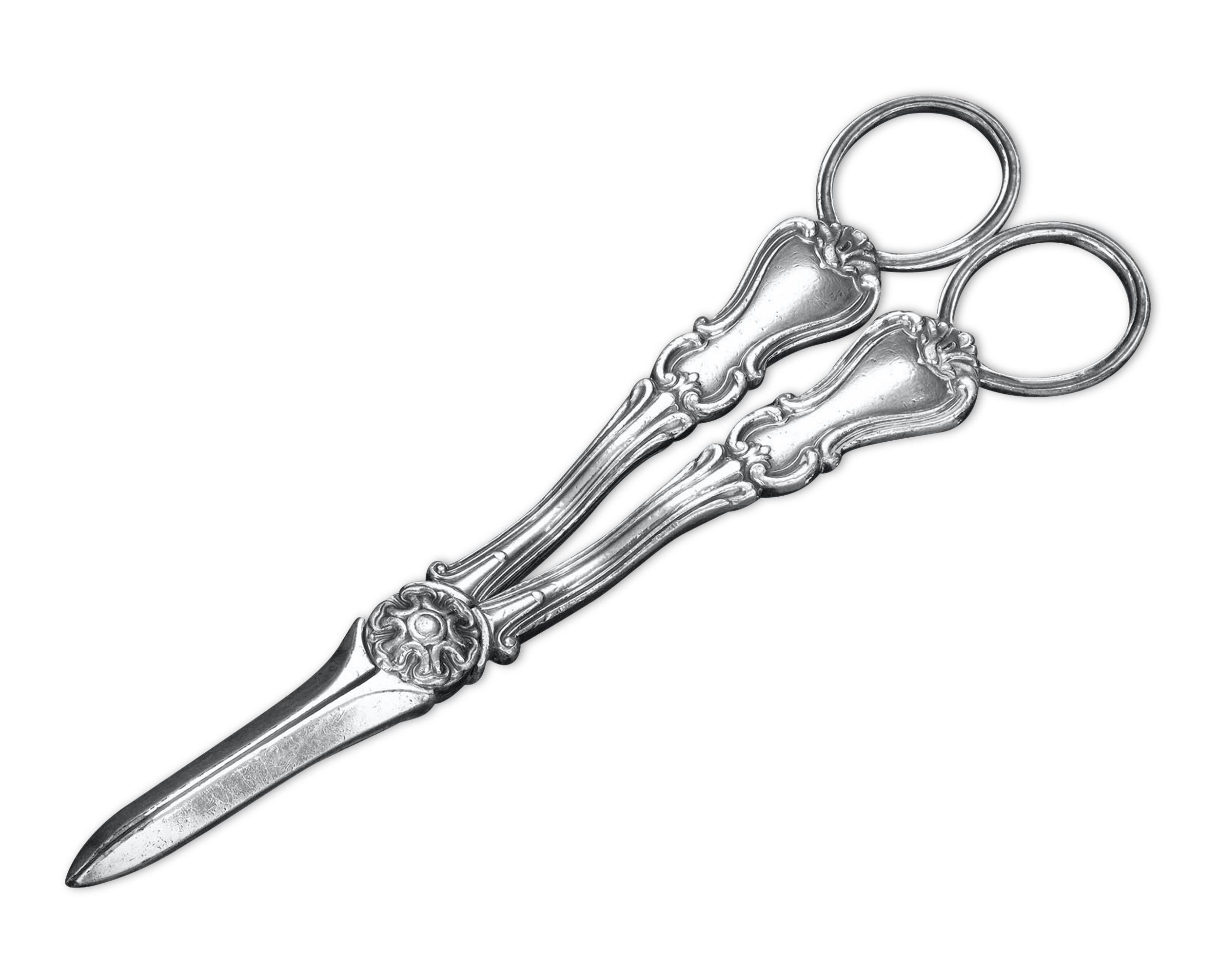 This rare pair of silver grape shears was crafted by Paul Storr, one of history’s most renowned silversmiths. An uncommon item in Storr's extraordinary catalog, this elegant pair of shears boasts a sophisticated neoclassical design, and contains all