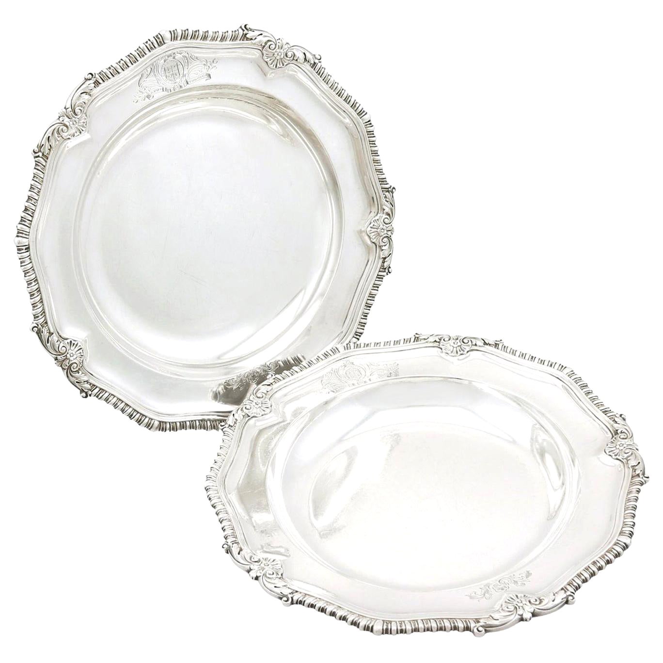 An exceptional, fine and impressive pair of antique George IV English sterling silver soup plates made by Paul Storr, an addition to our range of ornamental dining silverware.

These exceptional antique George IV sterling silver soup bowls or