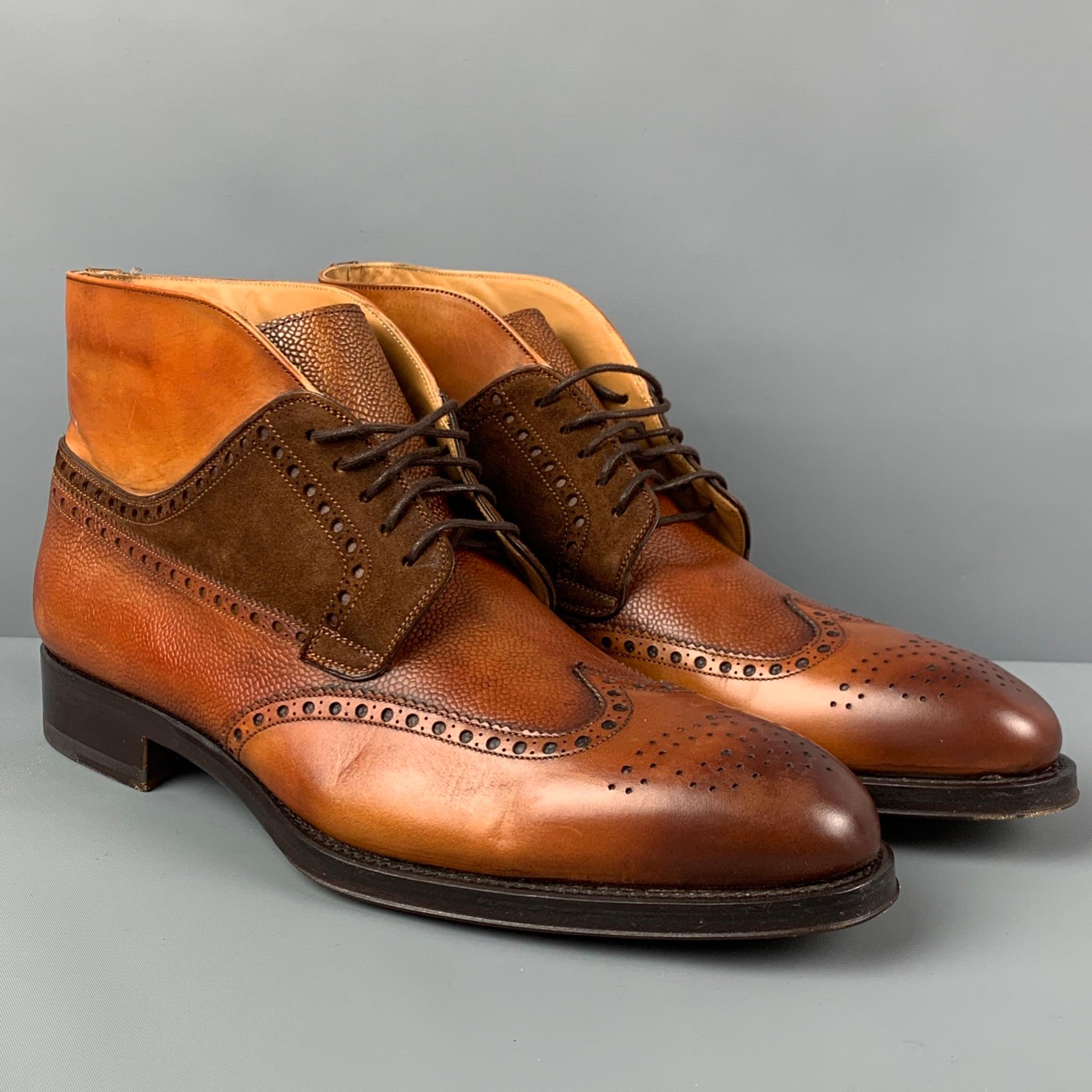 PAUL STUART boots comes in a tan & brown leather featuring a wingtip style, suede trim, and a lace up closure. Made in Spain. 

Very Good Pre-Owned Condition.
Marked: 43.5

Measurements:

Length: 12.5 in.
Width: 4.5 in.
Height: 5 in. 