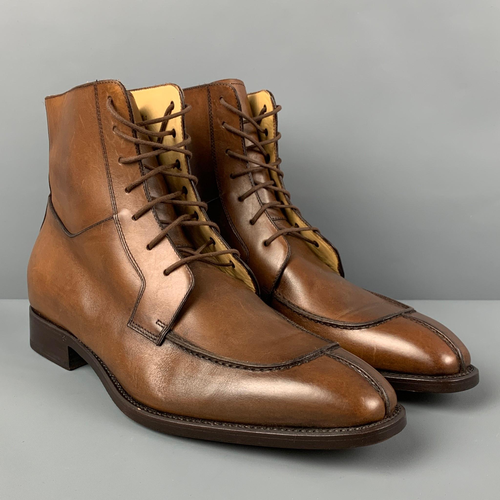PAUL STUART boots comes in a brown antique leather featuring a split toe and a lace up closure. Made in Italy. 

Very Good Pre-Owned Condition.
Marked: 7229 11

Measurements:

Length: 12.25 in.
Width: 4.25 in.
Height: 6 in. 