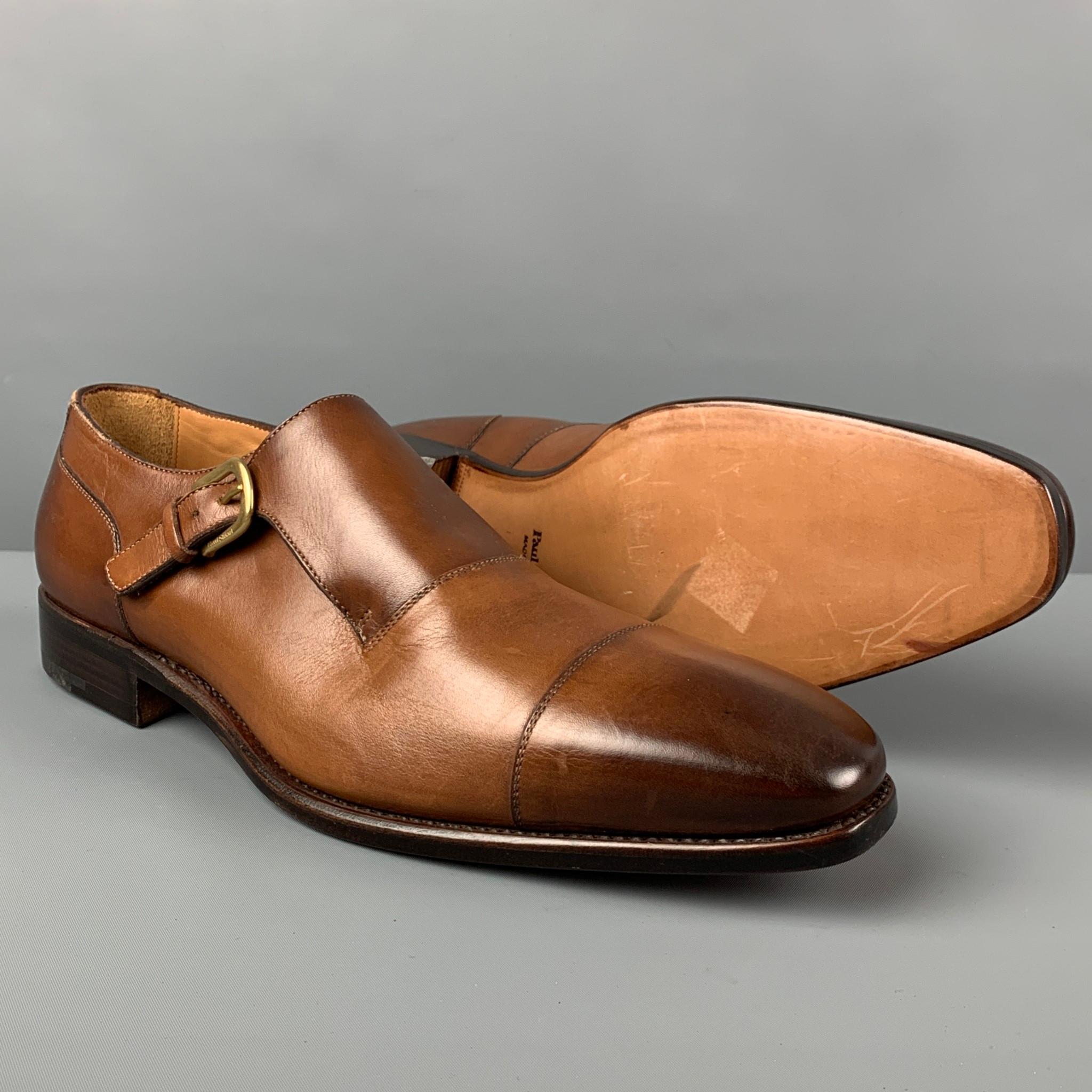 PAUL STUART shoes comes in a tan antique leather featuring a cap toe and a monk strap. Made in Italy. 

Very Good Pre-Owned Condition.
Marked: 10 U /11 US

Outsole: 12.75 in. x 4 in. 