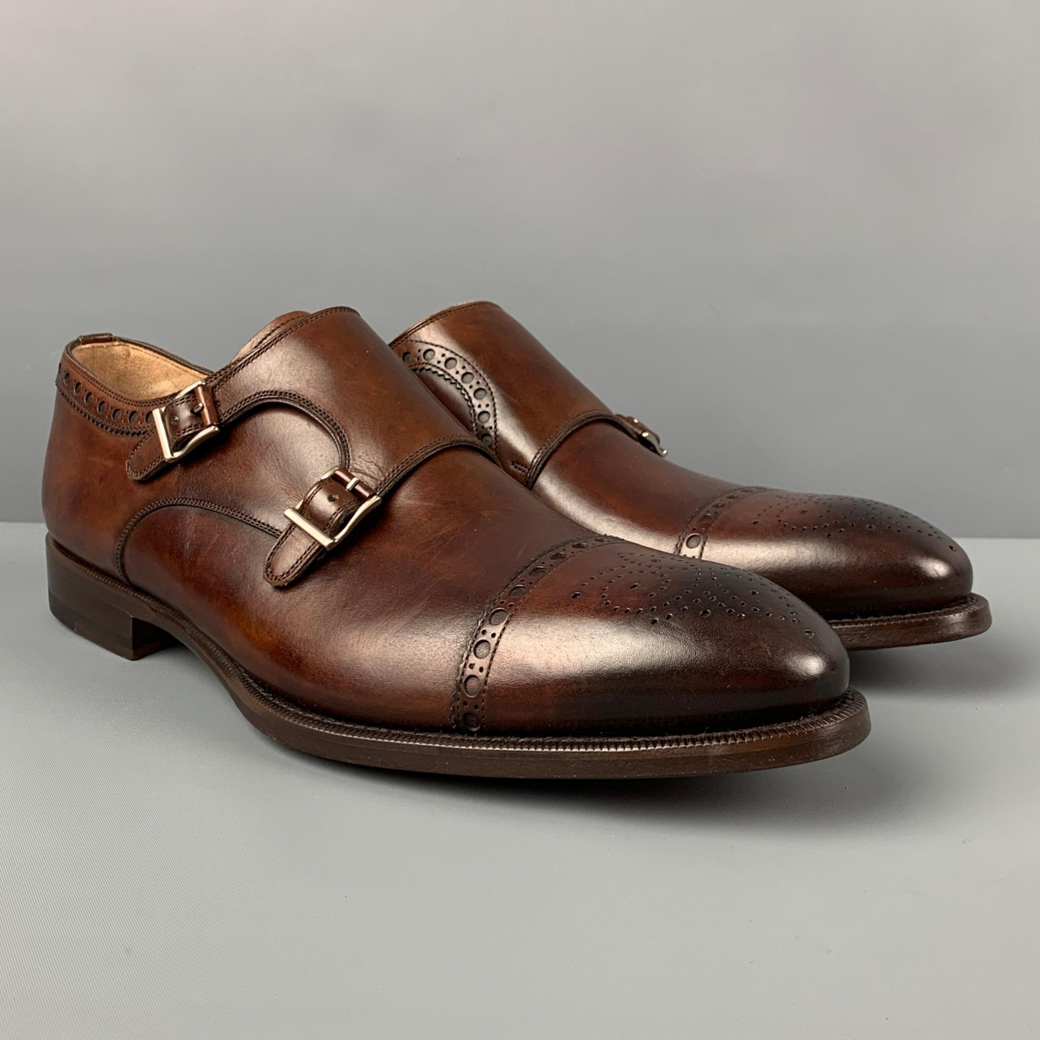 PAUL STUART loafers comes in a dark brown antique leather featuring a cap toe and double monk strap. Made in Spain. 

Excellent Pre-Owned Condition.
Marked: 44.5

Outsole: 12.75 in. x 4.5 in. 