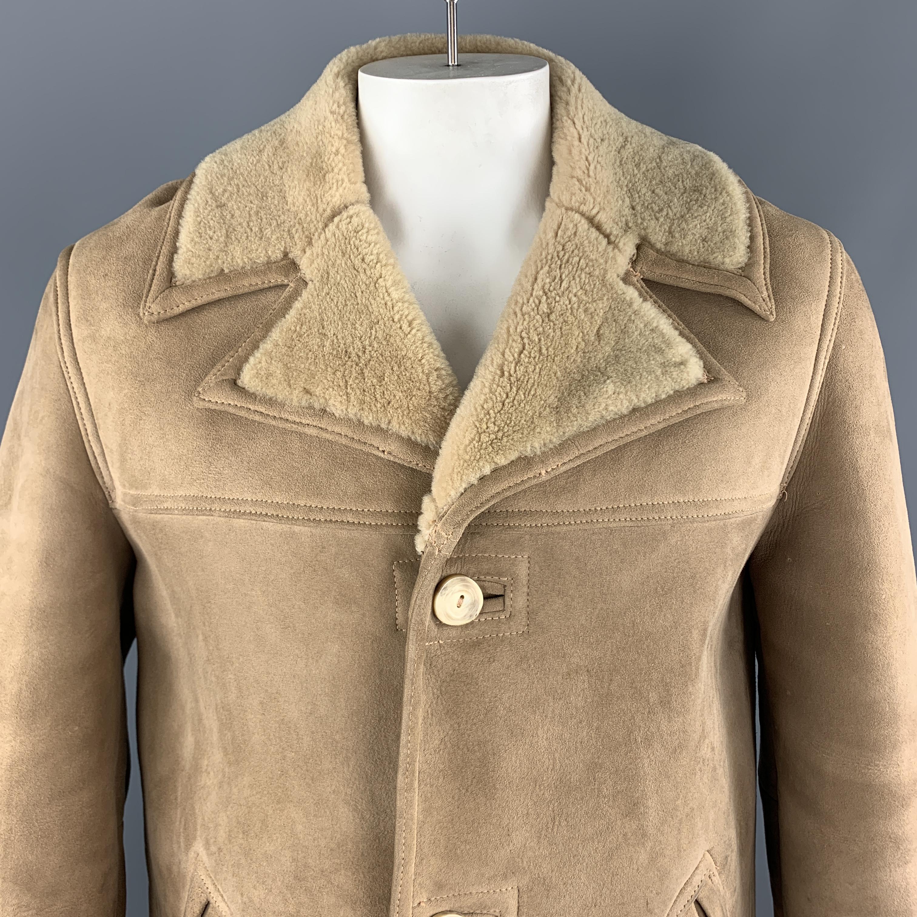 PAUL STUART Coat comes in a tan shearling material, with a contrast notch lapel, three buttons at closure, single breasted, patch pockets, and a single vent at back, unlined. 

Excellent Pre-Owned Condition.
Marked: US 40

Measurements:

Shoulder: