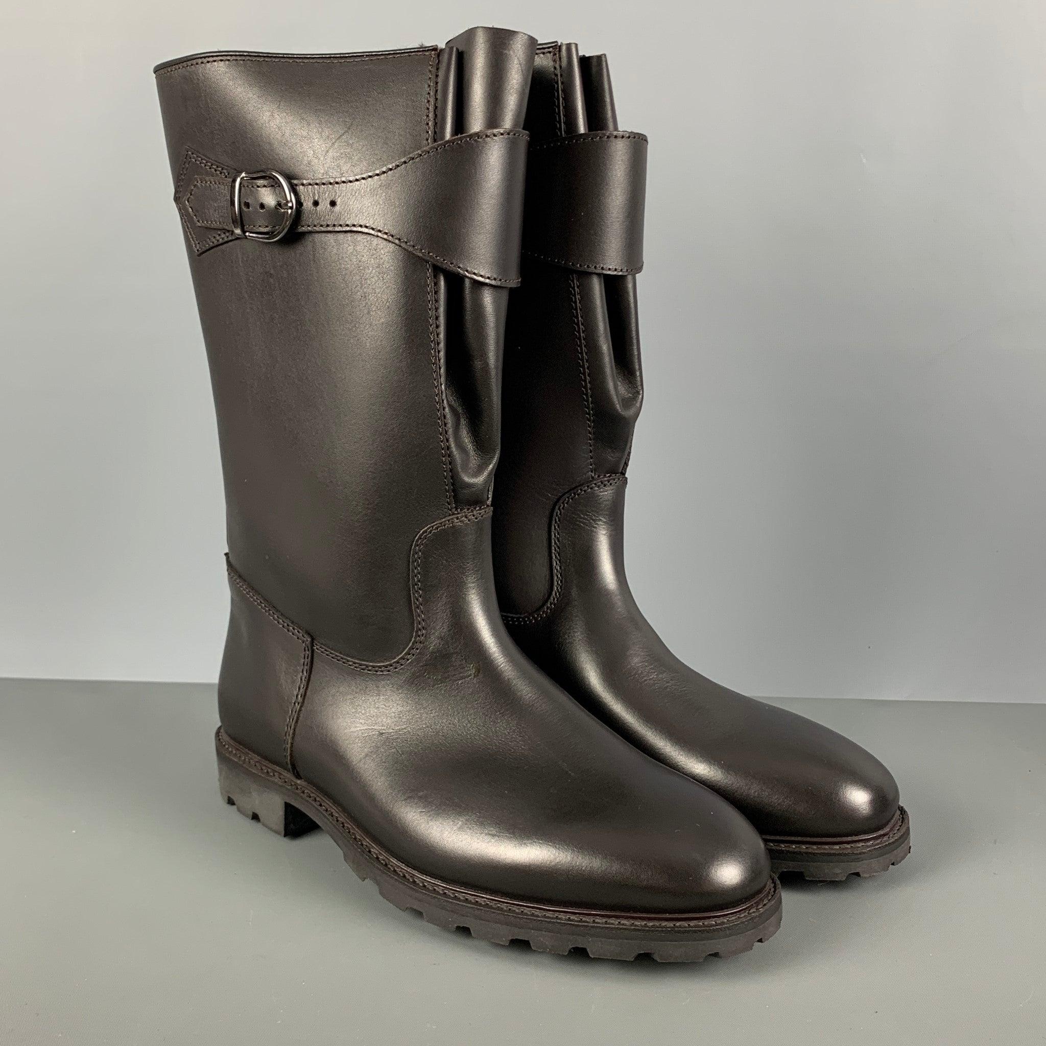 PAUL STUART boots comes in a brown leather featuring a faux fur inside texture, brass buckle closure, pull on style, knee high, and a short chunky heel. New with Box. 

Marked:   2 1183 

Measurements: 
  Length: 11 inches Width: 4 inches Height:13