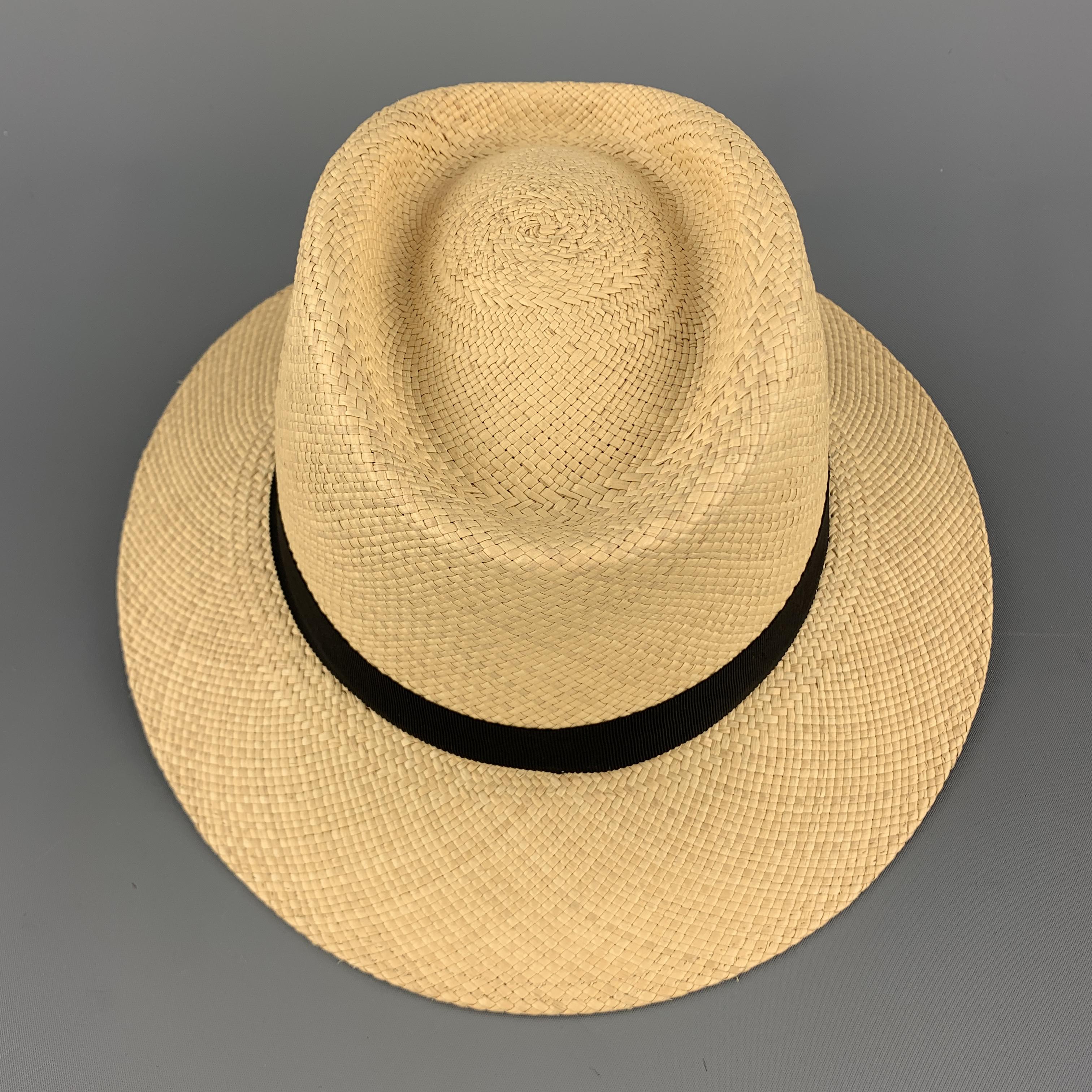 PAUL STUART Panama hat comes in natural woven straw with a black grosgrain trim. Made in Ecuador.

Excellent Pre-Owned Condition.
Marked: (no size)

Measurements:

Opening: 23 in.
Brim: 2.25 in.
Height: 4 in.