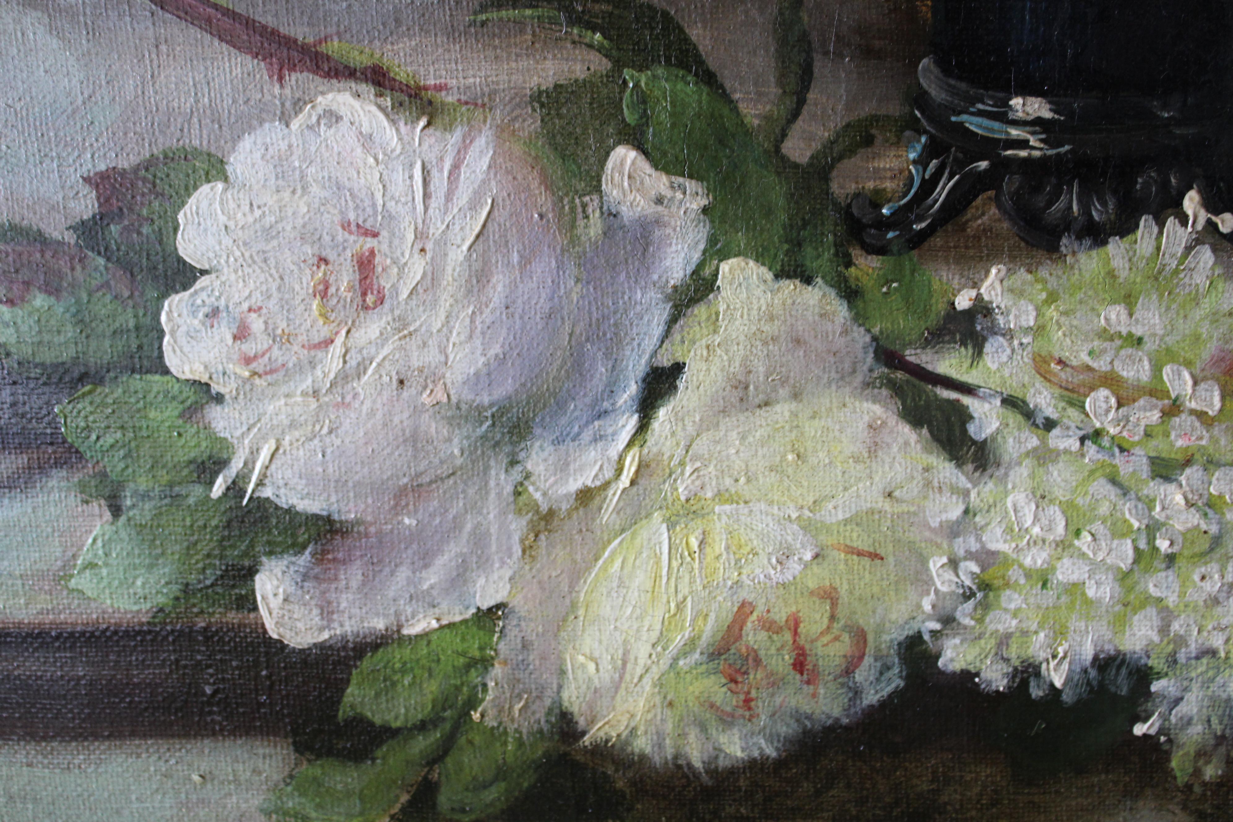 A large and stunningly beautiful still life oil painting by French artist Paul Tourrette (1866-1917).  Two vases sit on a table, perhaps the flowers have come from the garden, freshly picked, arranged and ready to paint.  Roses and lilacs in a