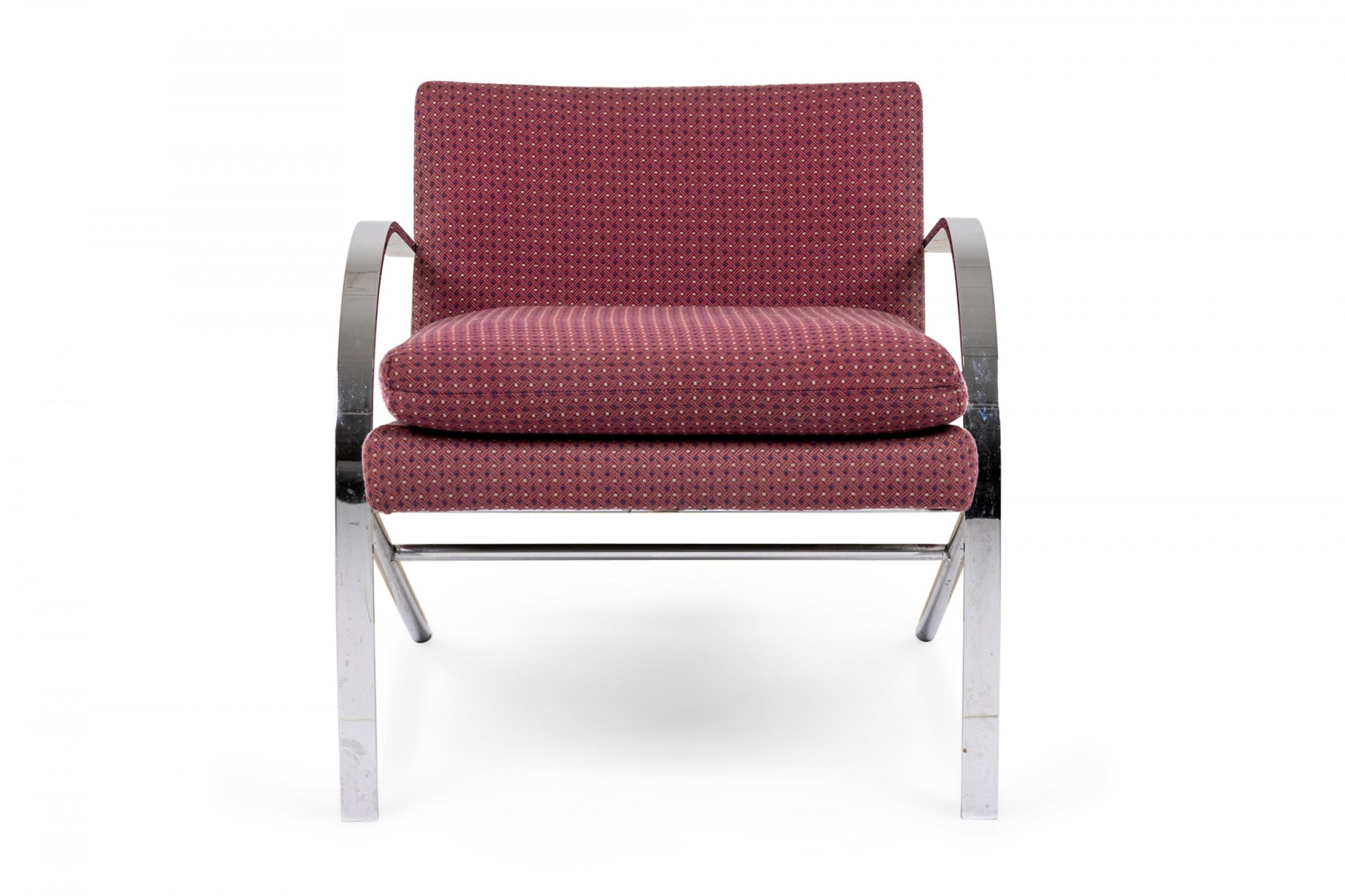 American Mid-Century 'Arco' form lounge / armchair with muted red upholstery with a geometric navy blue and beige dot pattern and removable seat cushion, supported by a chrome frame comprised of two arching beams that create both the arms and front