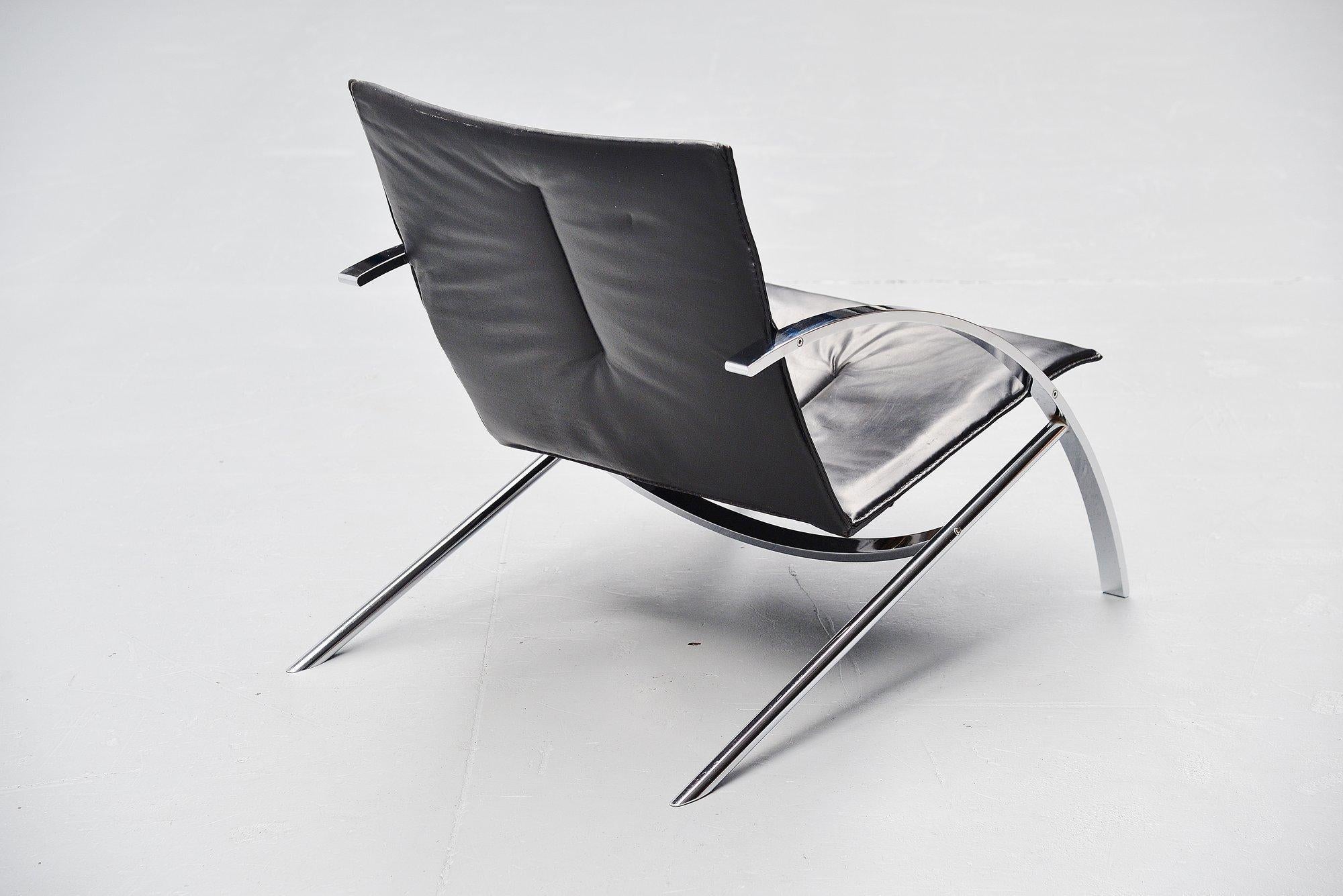 Fantastic dynamic lounge chair model Arco designed by Paul Tuttle for Strassle International, Switzerland 1976. Super heavy quality lounge chair in heavy solid chrome plated metal and high quality black leather upholstery. Very nice low lounge chair