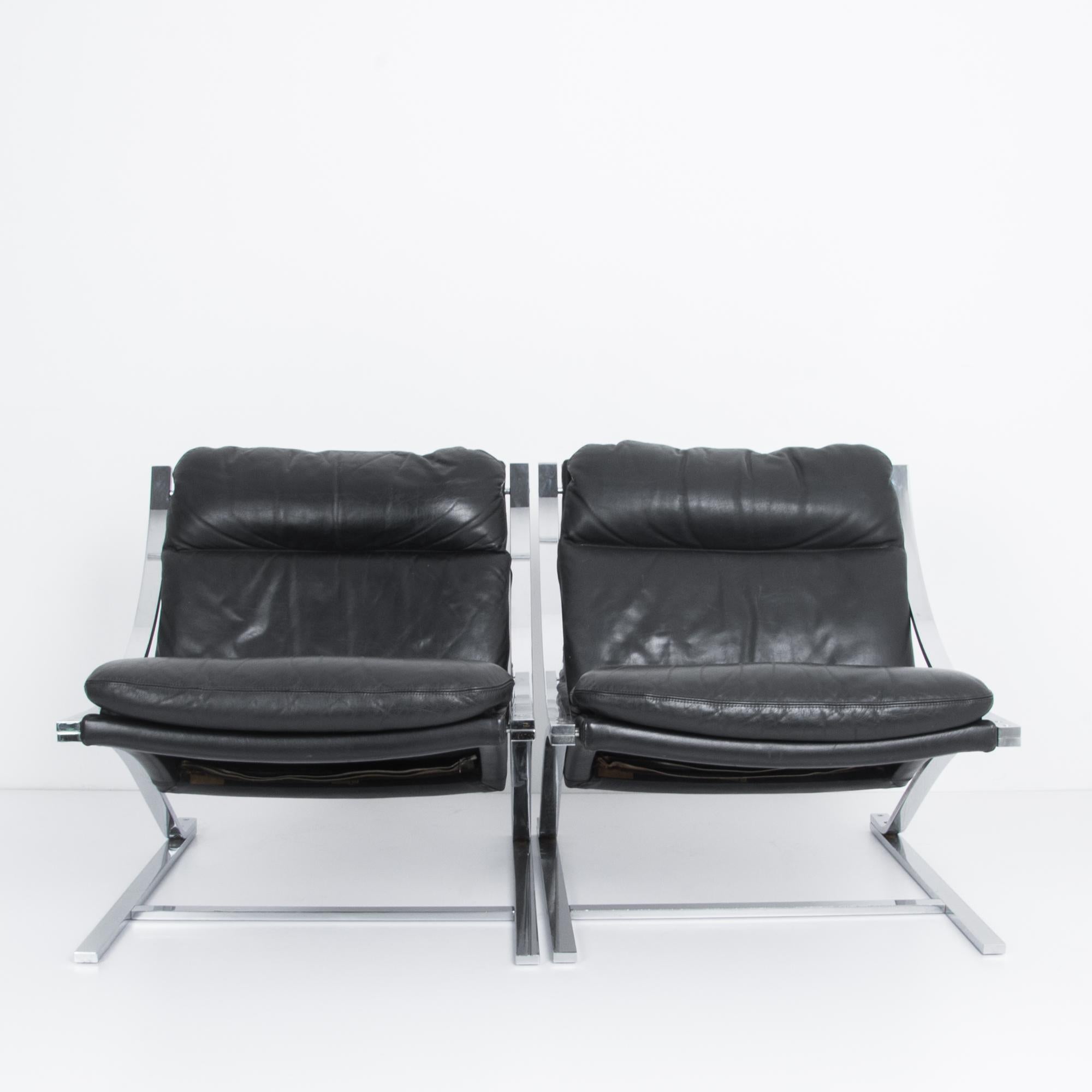 A classic design by Paul Tuttle, the “Zeta” chairs are framed by a distinctive chrome armature; a cantilevered letter Z. The alphabetical motif became a benchmark in the pantheon of midcentury furniture. Here in iconic black leather manufactured to