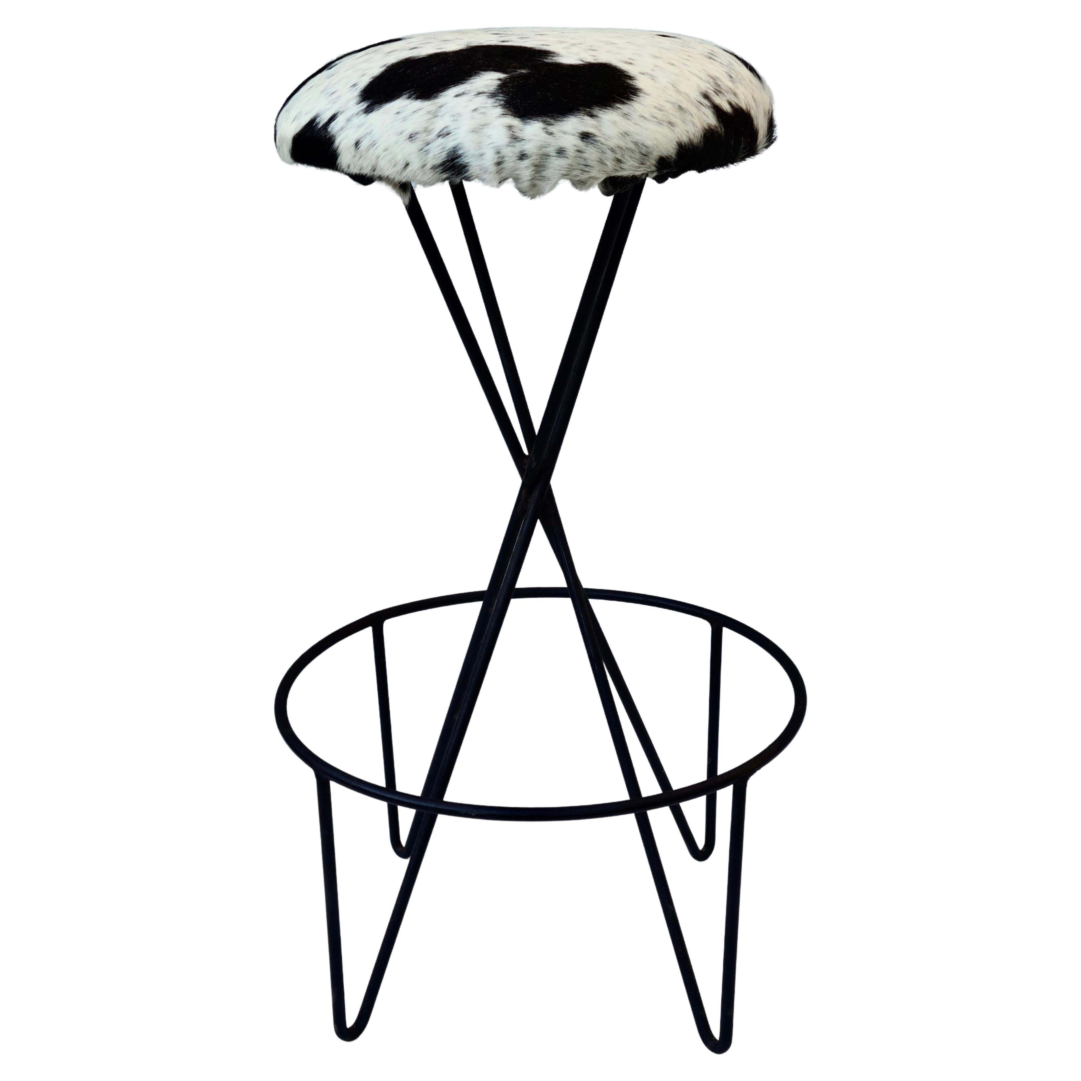 Please feel free to reach out for accurate shipping to your location.

Wrought Iron and Cowhide Barstool.

Designed by Paul Tuttle for Modern Color Inc.