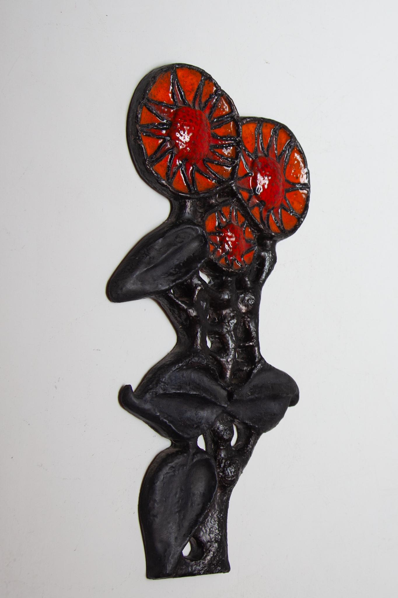 Beautiful large 1960's Belgian ceramic wall art piece fat lava flowers. Beautifully abstracted flower wall sculpture was a cooperation between Perignem and Paul Vermeire. A colorful decorative ceramic wall mounted sculpture with colors in deep red,