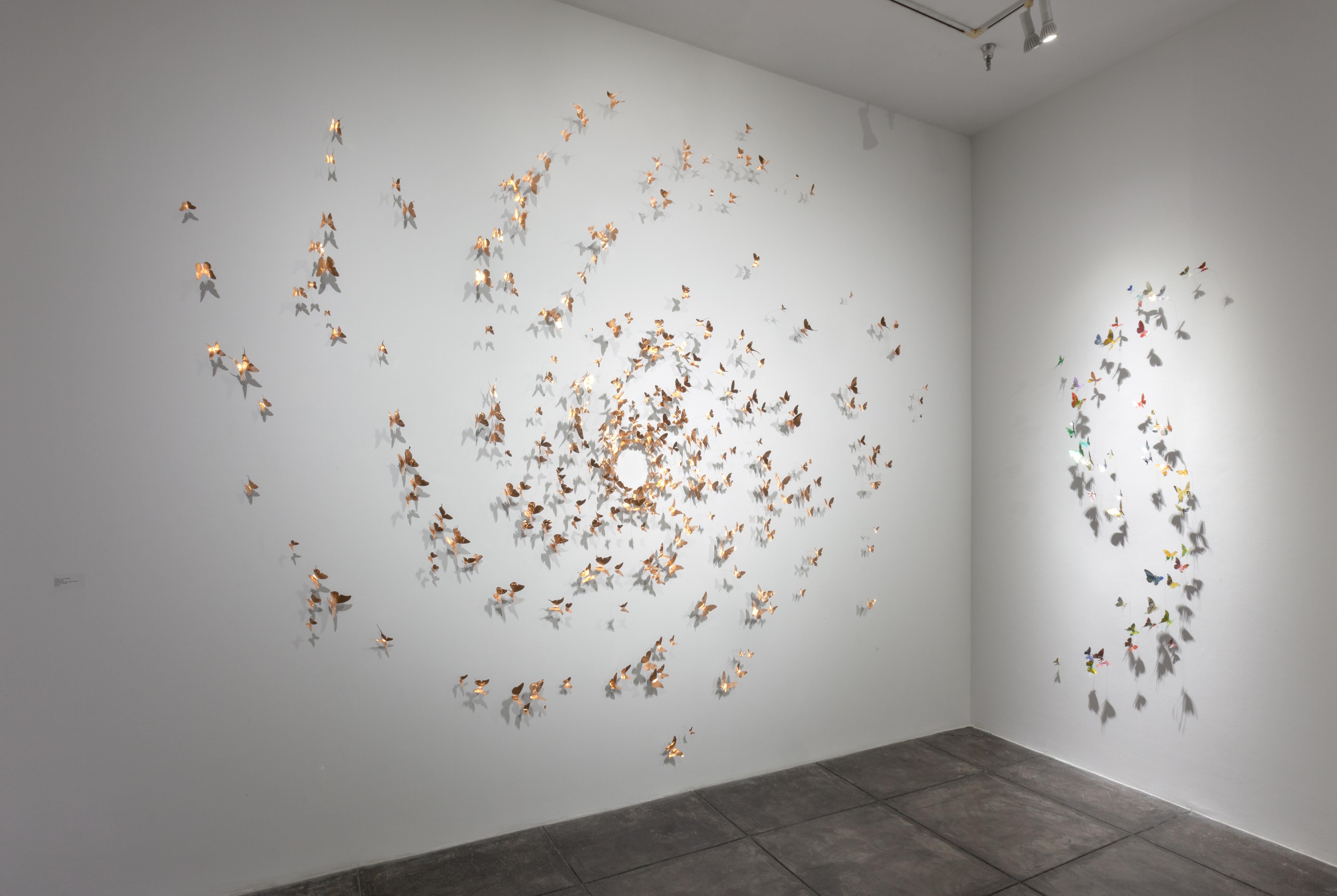 medium: aluminum (found cans), wire

Available in multiple color/finish options (inquire with gallery).
Installations are made to order, sizes and shapes of butterflies vary. 
Unique, open edition.
Ships with installation template and loaner tool