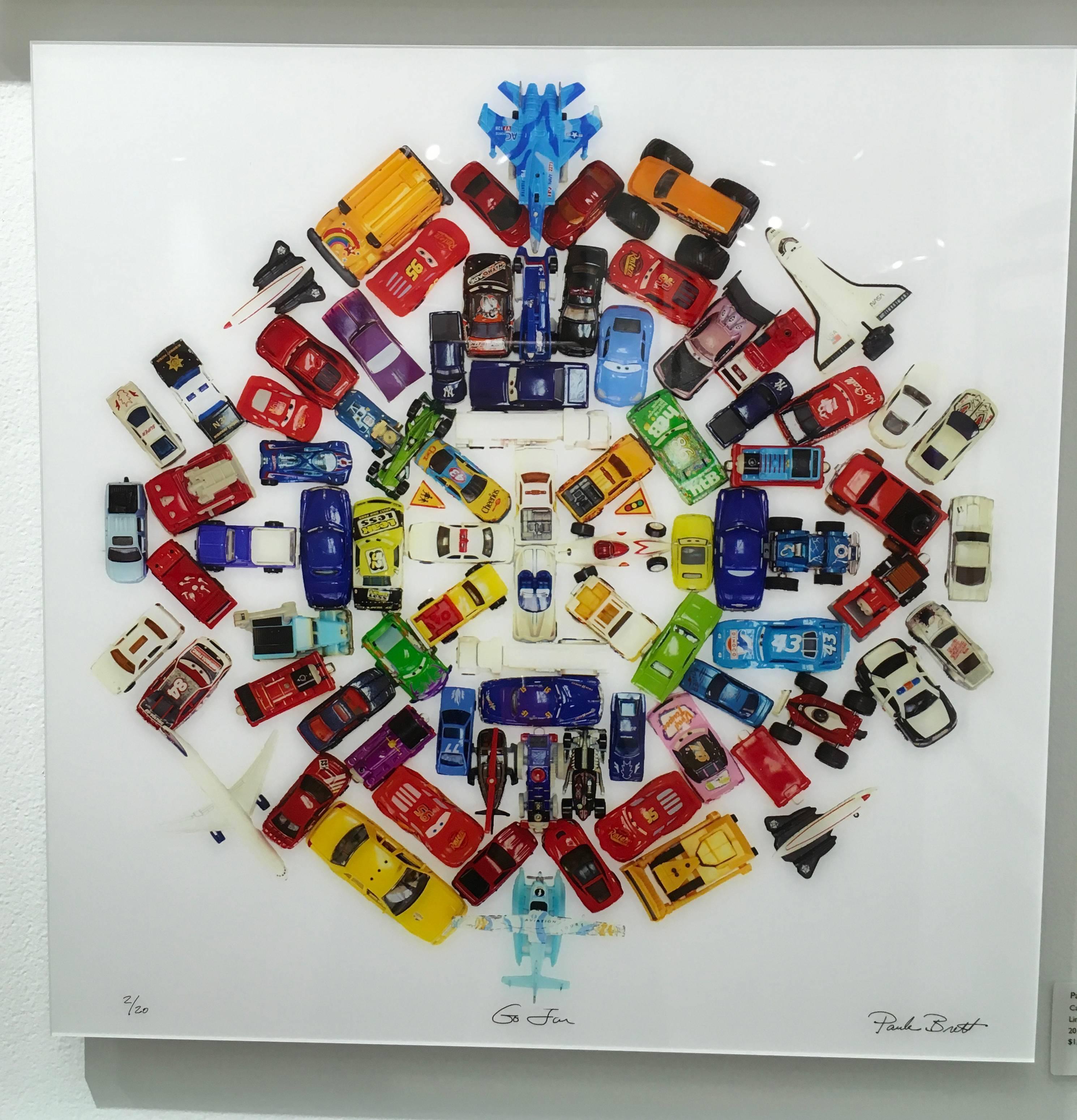 These limited edition photographs are Mandalas made from pieces of Candy or ice cream or toys or gems or fruit.  The Mandala is 20x20 with a white frame in a 24x24 framed size.  It is also available with plexifacemount framing.  It is an edition of