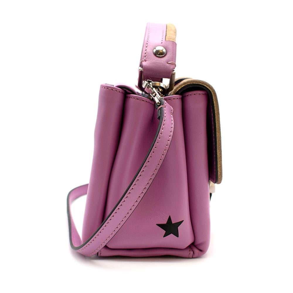 Paula Cademartori Dun Dun Star Pink Shoulder Bag 

- Magnetic Closure 
- Suede Detailing 
- Four Compartments 

Materials
- 100% Calf Leather 
- 100% Suede 

Strap: 48cm
Handle: 9cm
Width: 17cm
Hight: 14cm
Depth: 14cm